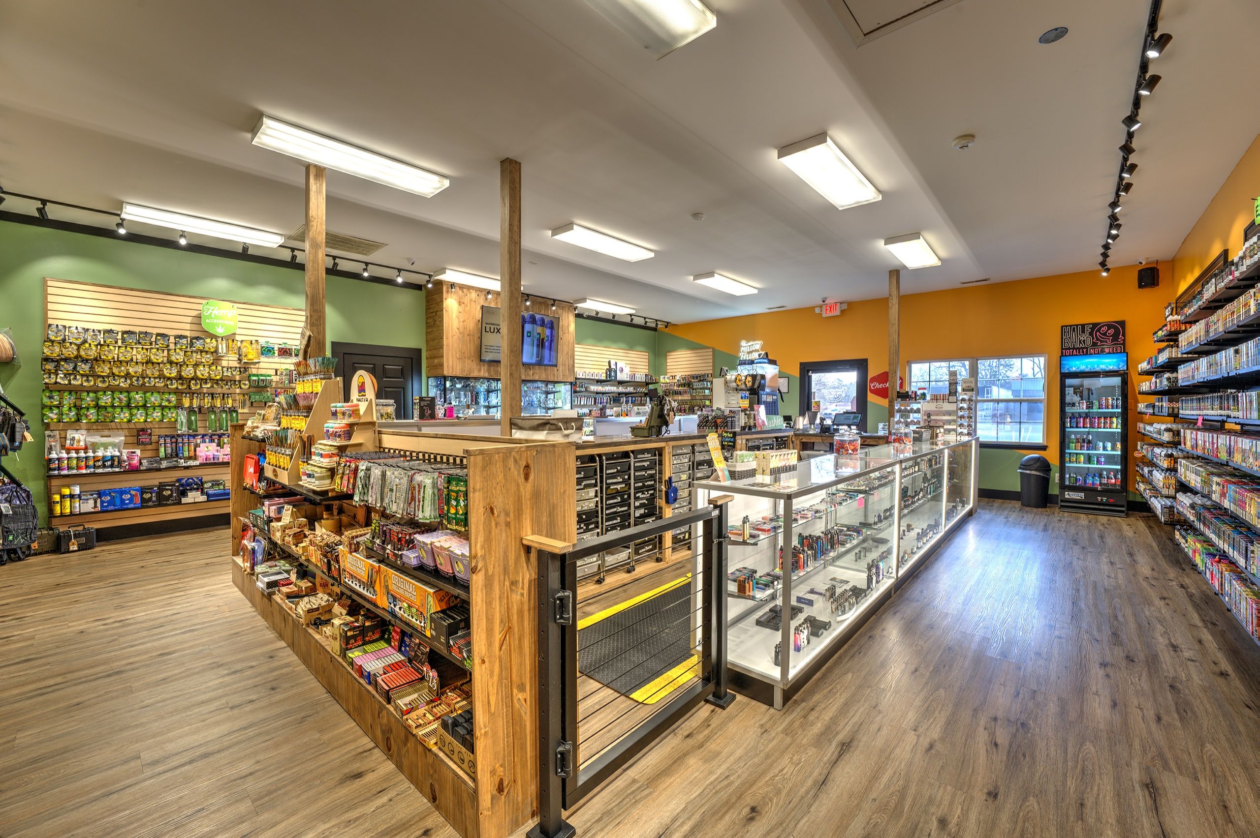 Front room with slat-wall merchandise and the main glass counter