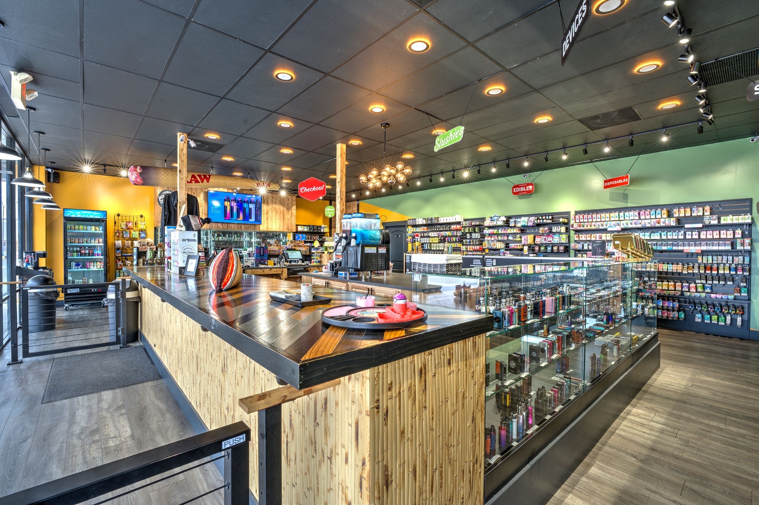 Checkout island stacked with counter displays, orange walls behind