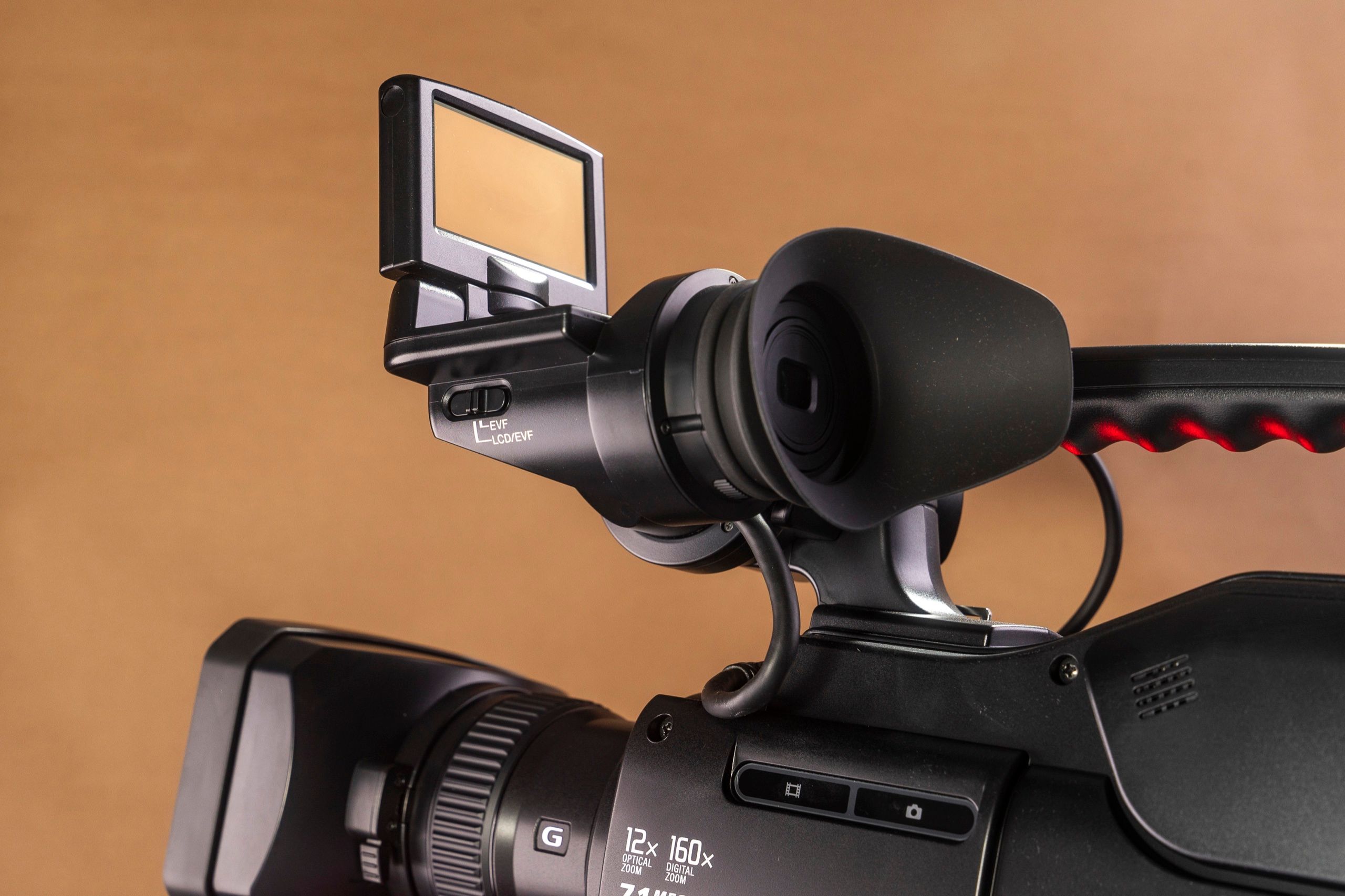 Flip-out monitor and eyecup of the same Sony camcorder, close up