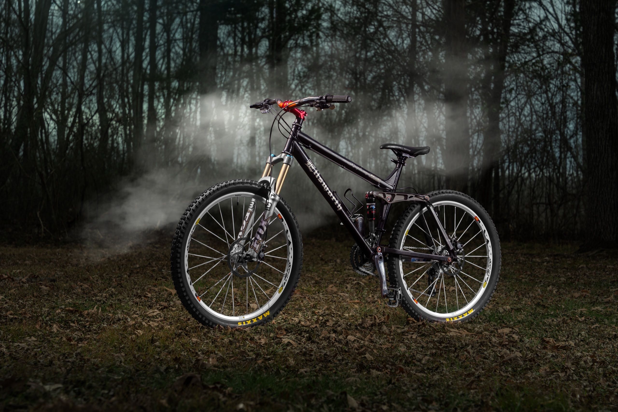 Ellsworth mountain bike lit against night fog in the woods
