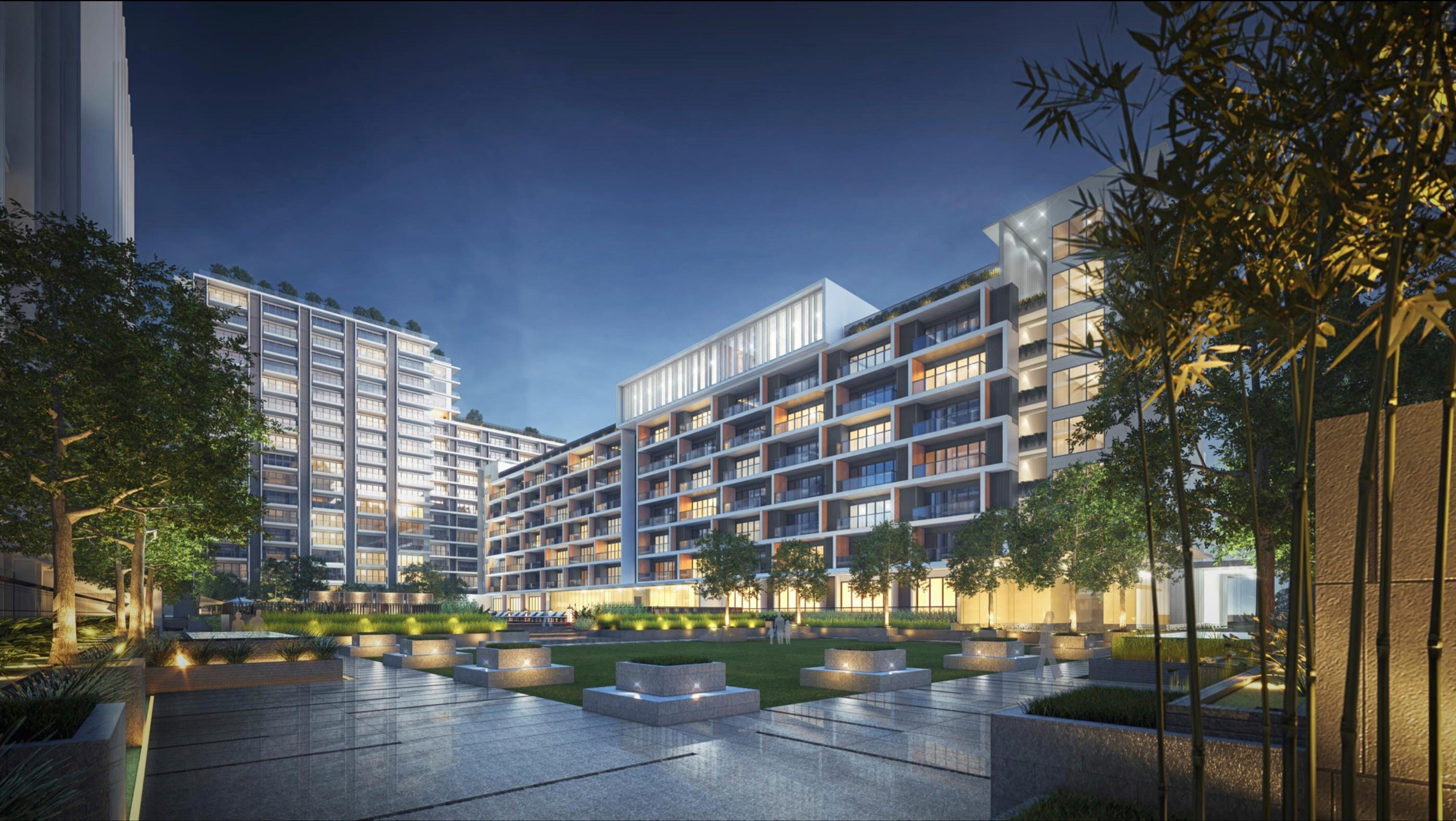Night render of the Gardencourt Residences towers around a landscaped courtyard at Arca South, Taguig City