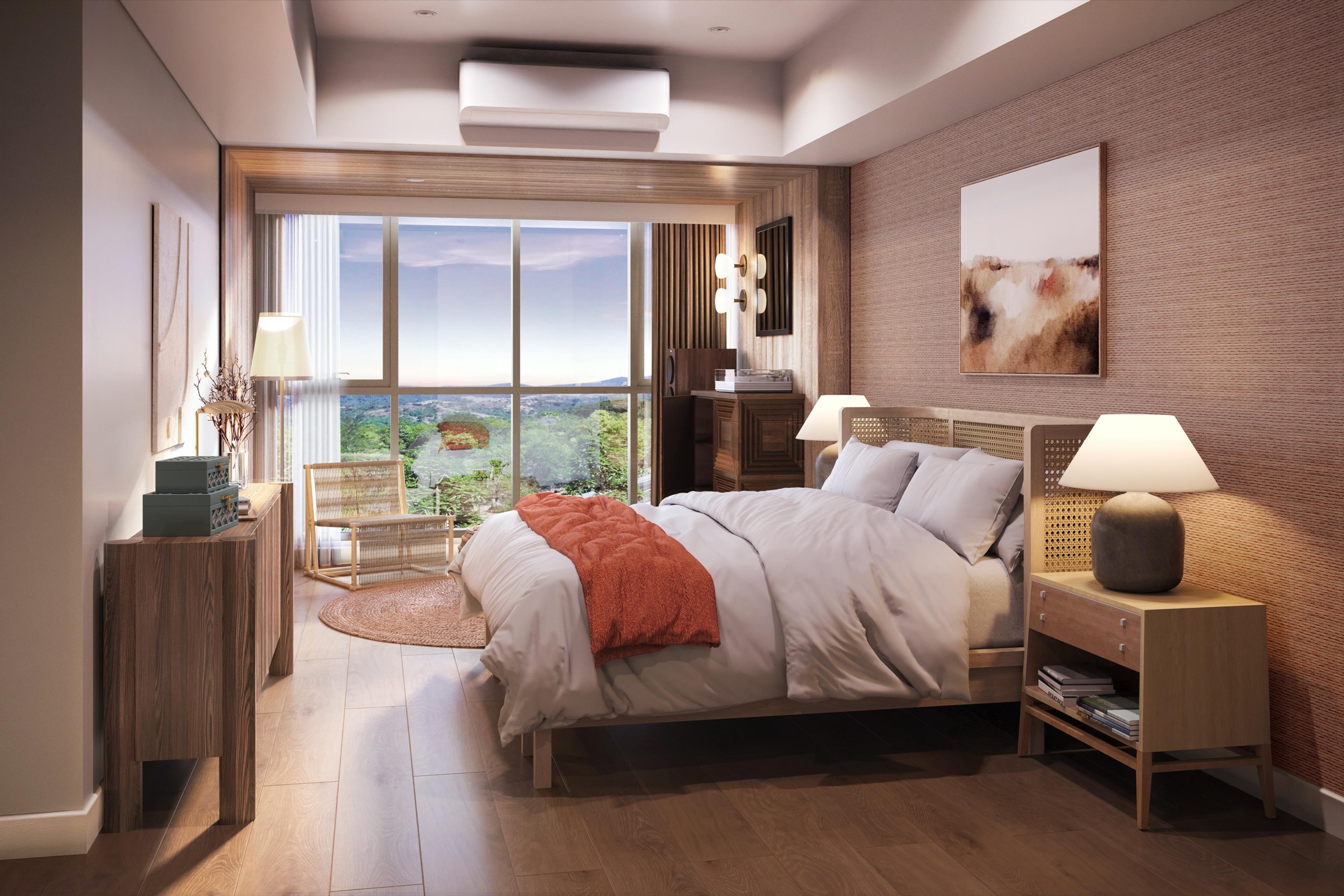 Render of a Searidge Residences two-bedroom bedroom, furnished in warm tones with a window framing the wooded coastal landscape