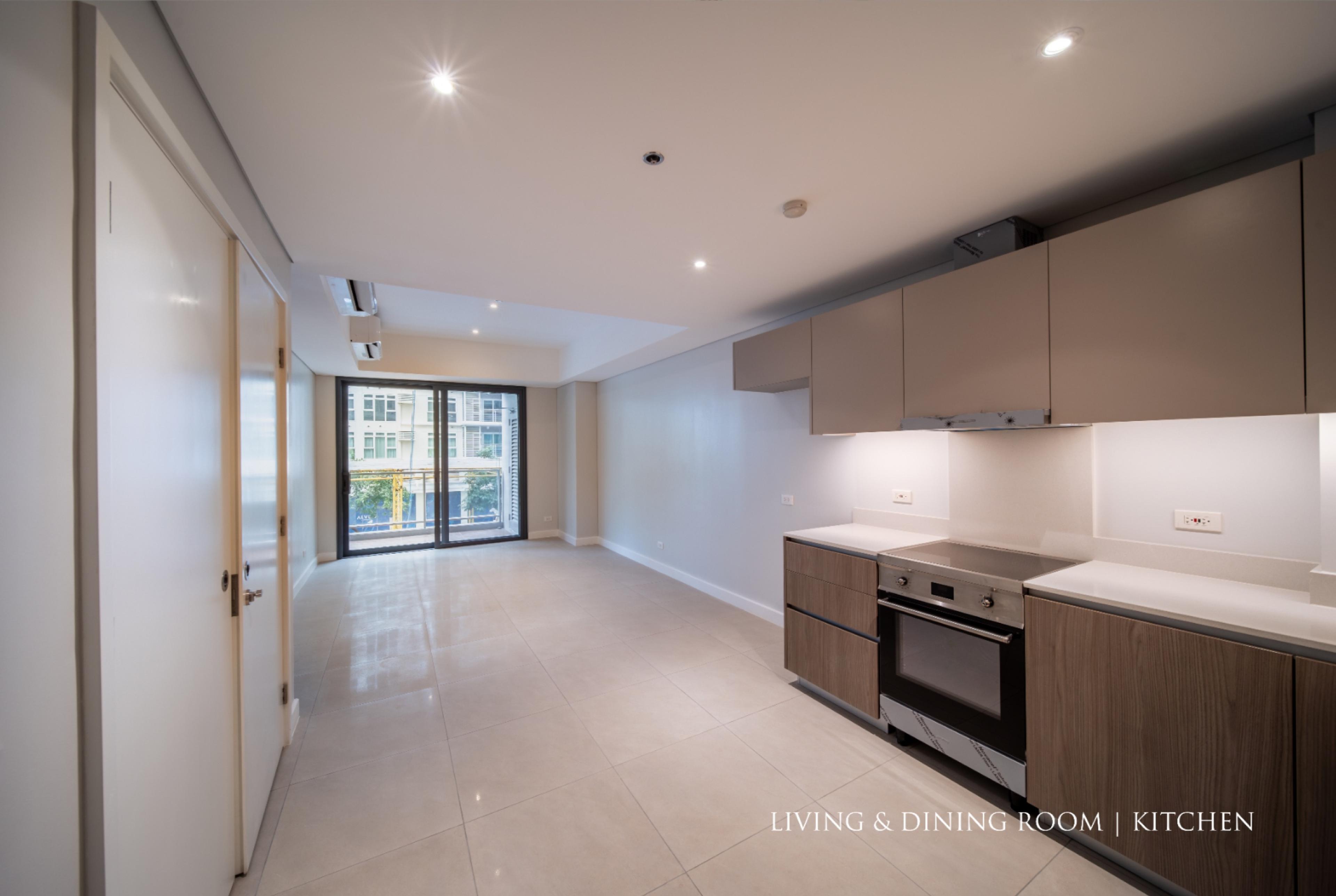 One-bedroom unit at Gardencourt Residences, living and dining area, Taguig City