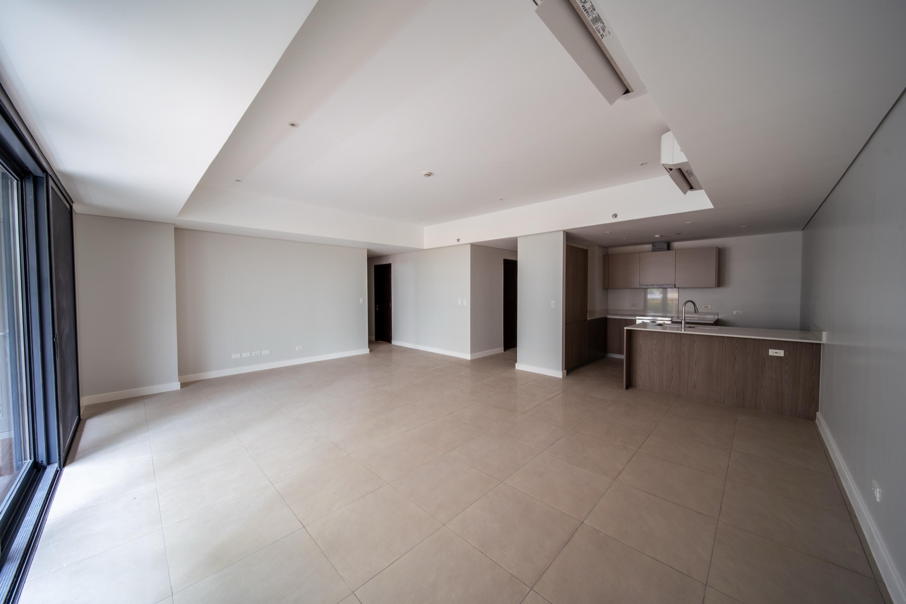 Two-bedroom unit at Gardencourt Residences, living, dining and kitchen area, Taguig City