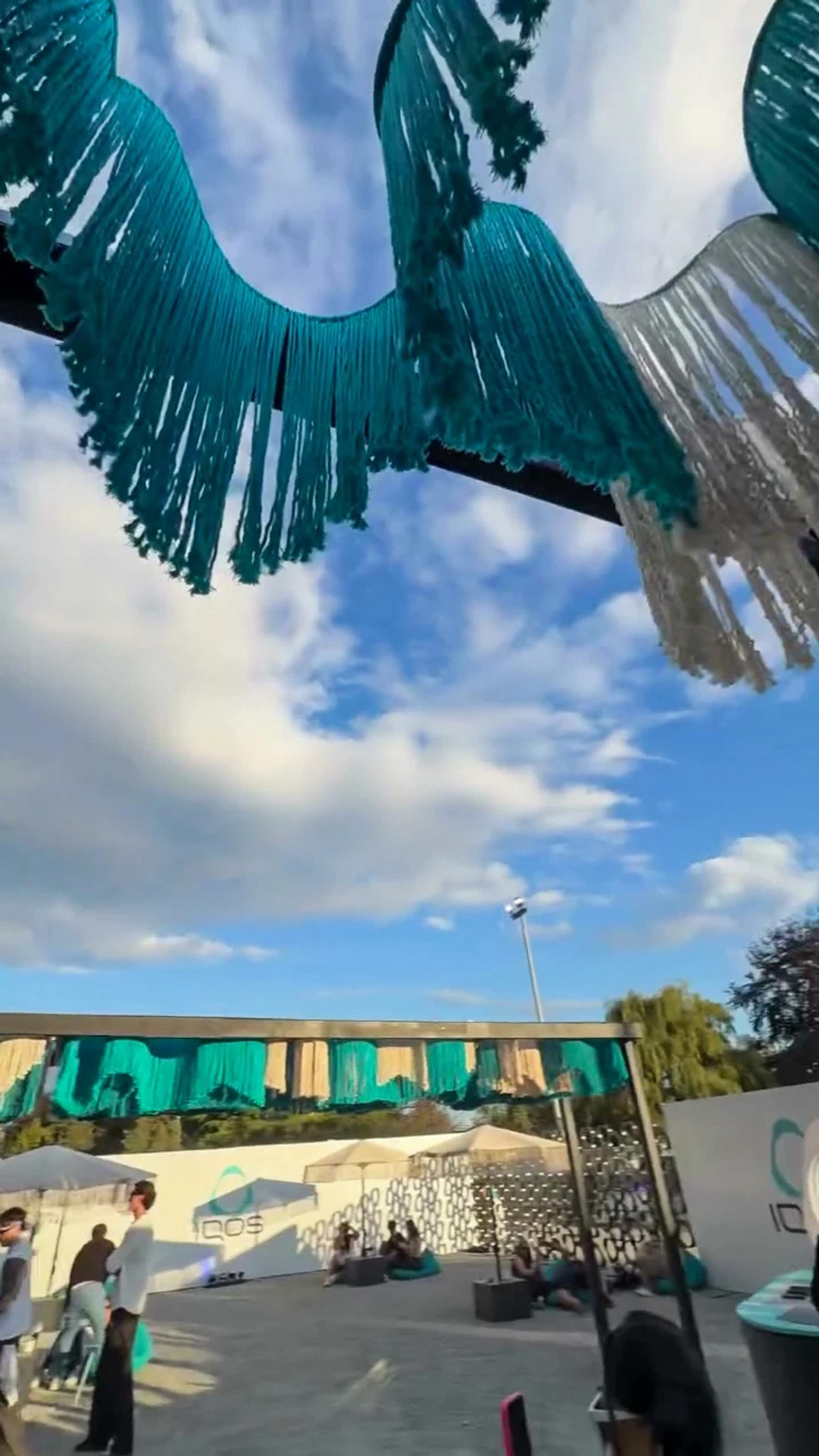 Woven strands seen against the sky at the installation