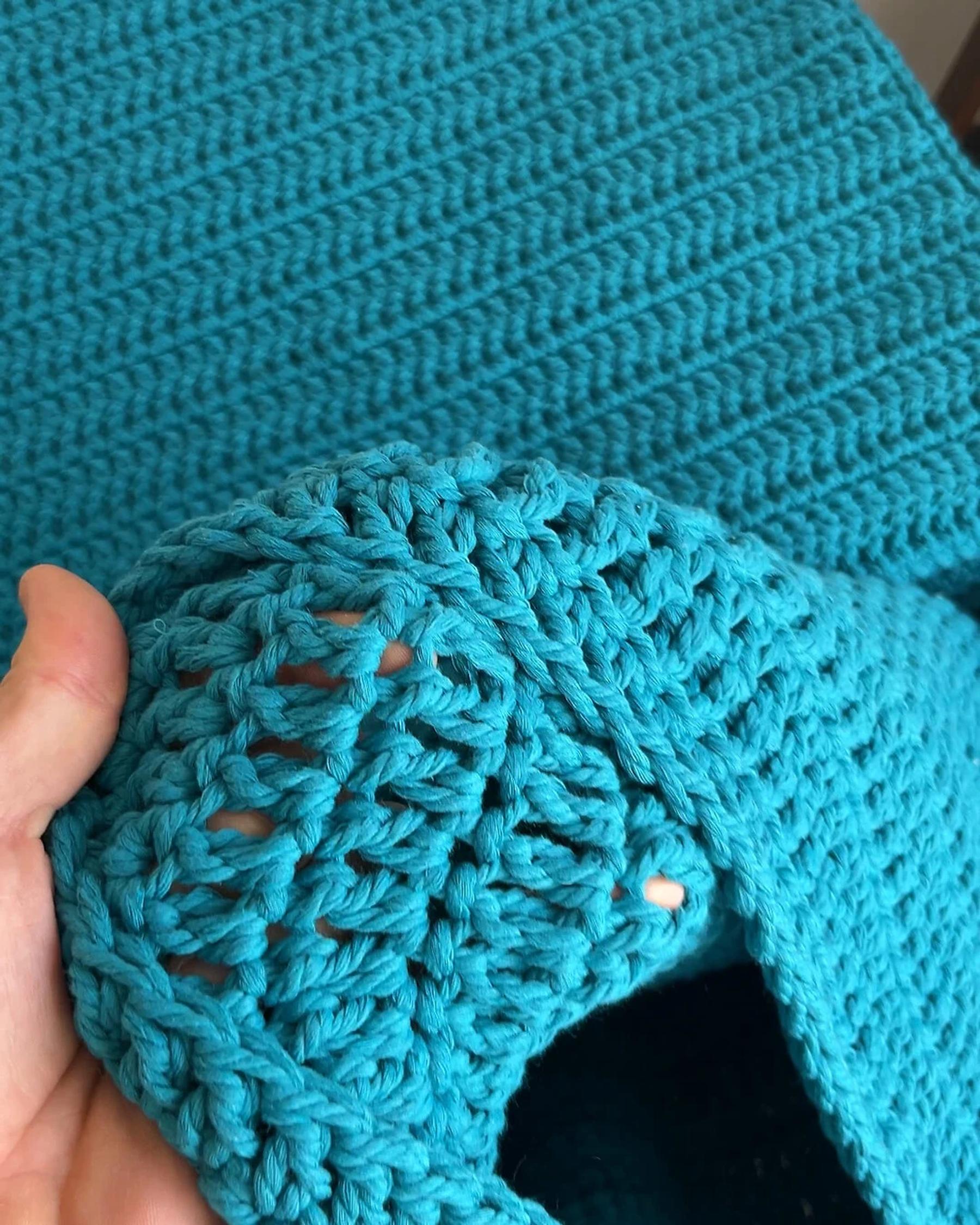 Close view of knotwork on a turquoise pouf