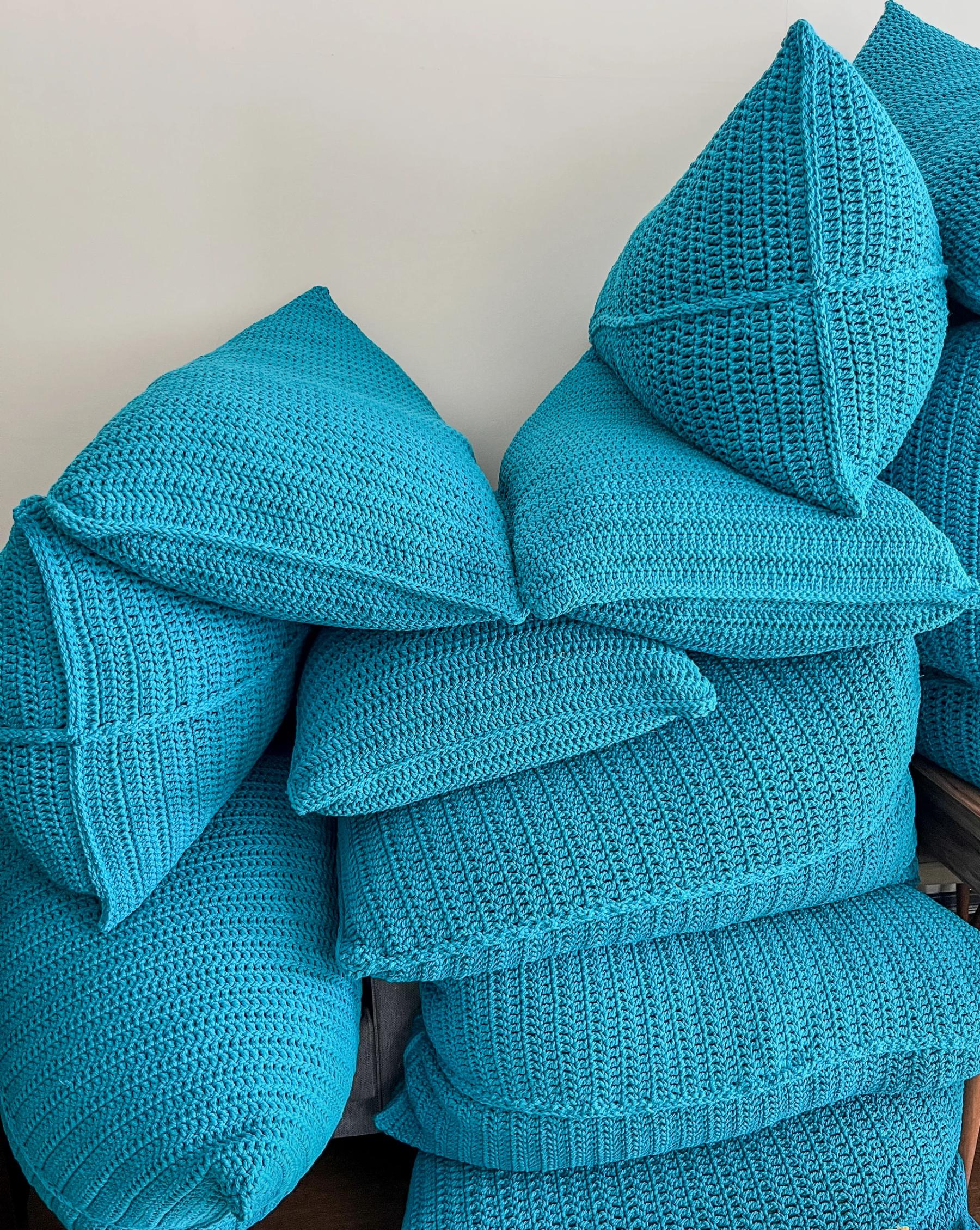 Turquoise handwoven poufs in the workshop