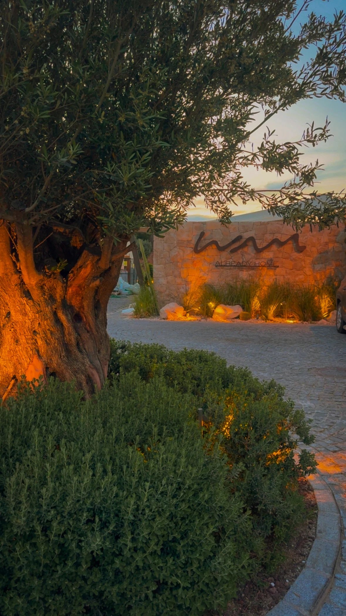 WAM by Karma entrance sign at dusk in Bodrum