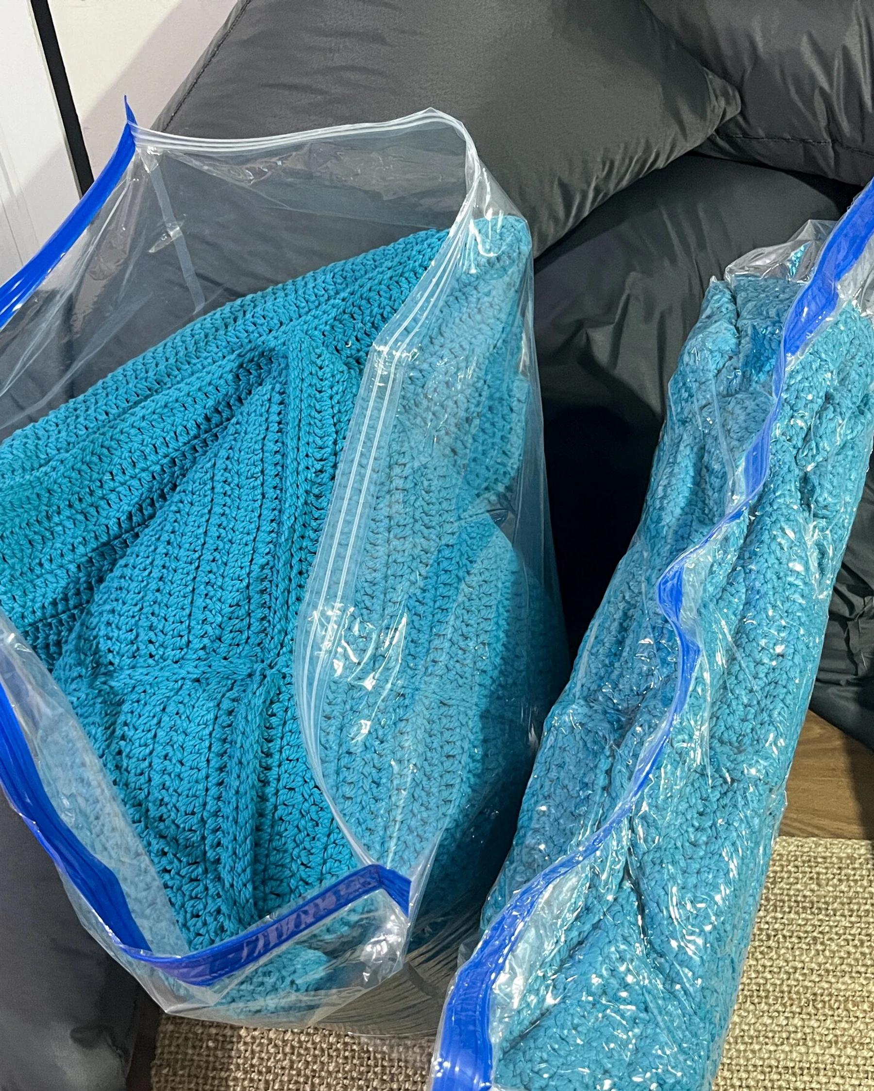 Turquoise pouf protected for shipment