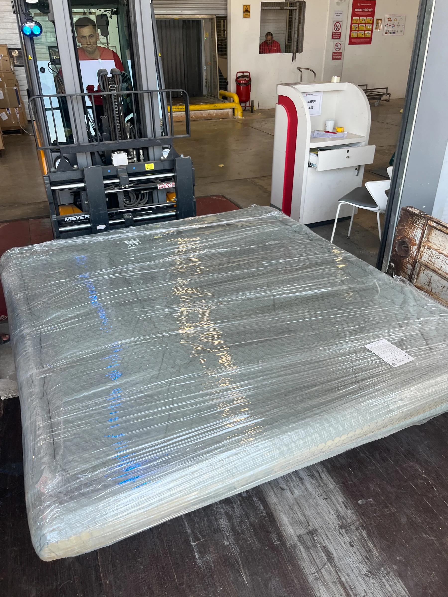 Wrapped panel frames ready for handling