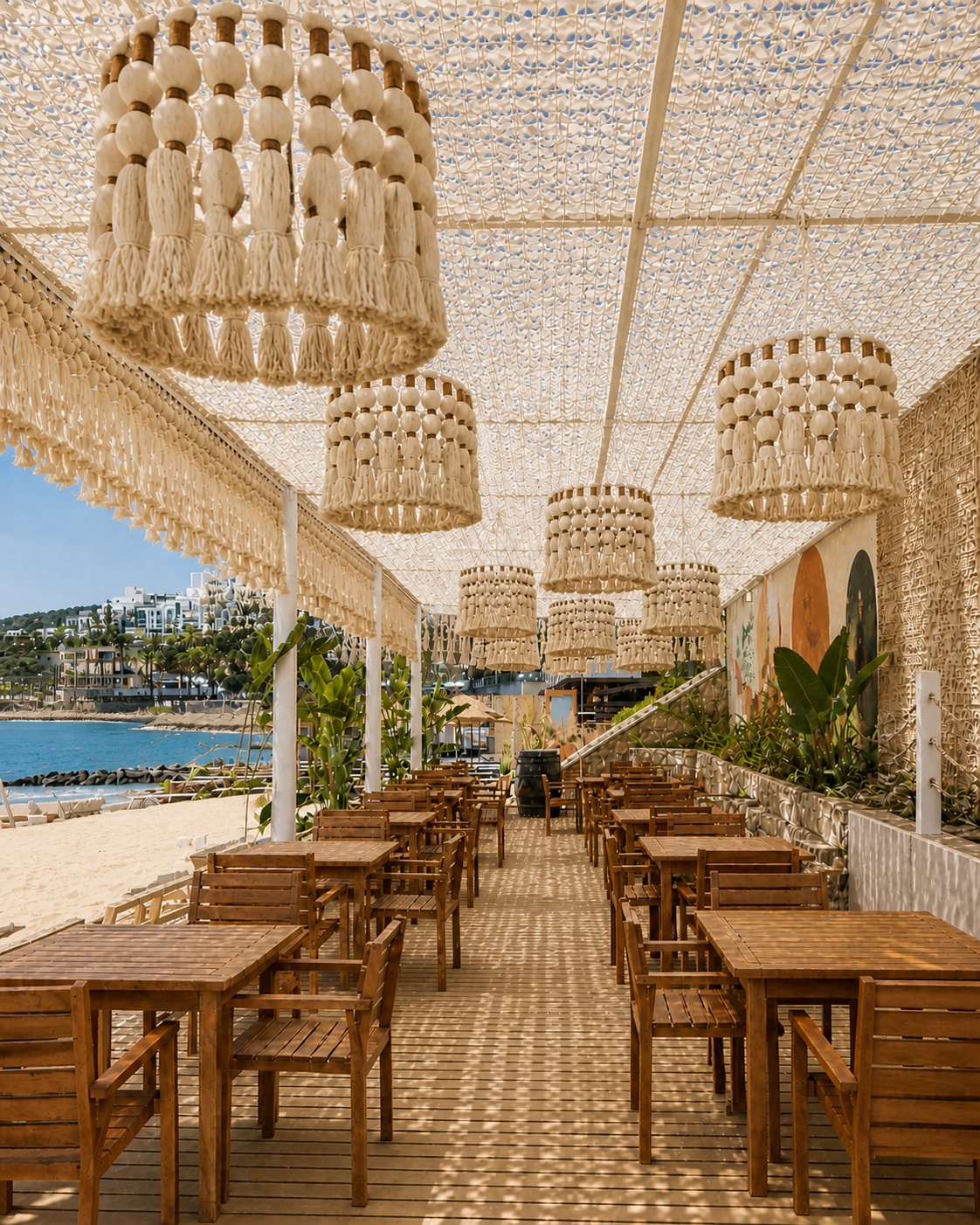 Large tasseled pendant forms beneath an open-weave ceiling above rows of restaurant tables at TUI Magic Life Bodrum.