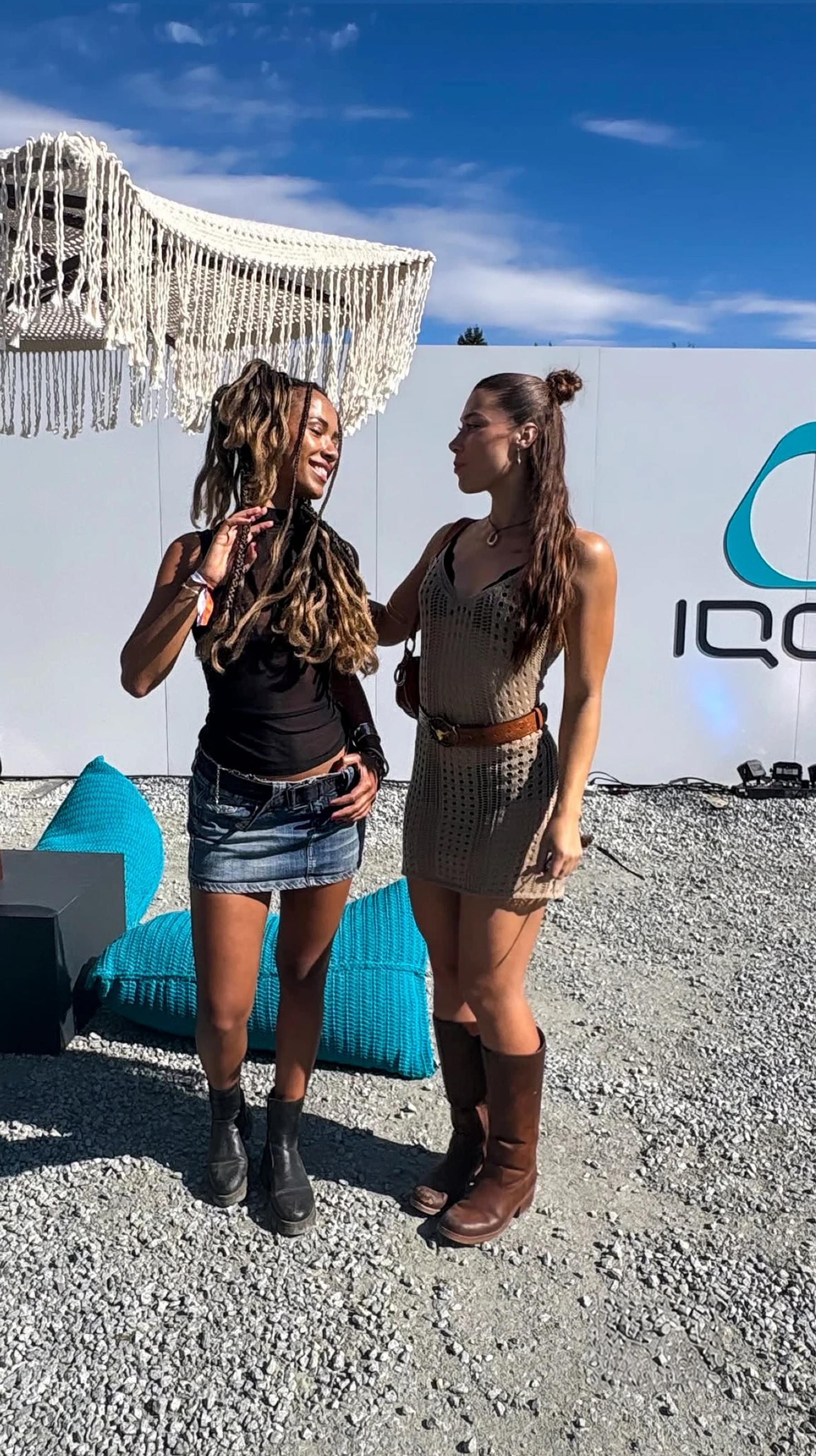 Visitors beside the IQOS backdrop