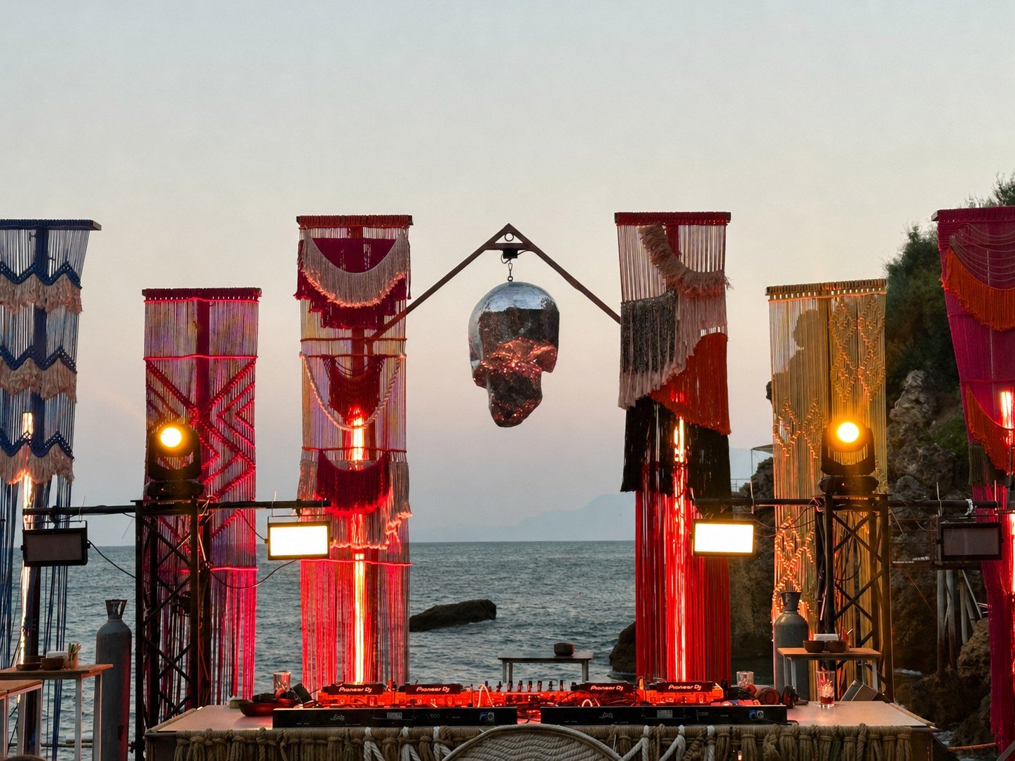 Dimare fibre-art banner columns and suspended mirrored centrepiece framing the DJ booth at Bilem Beach
