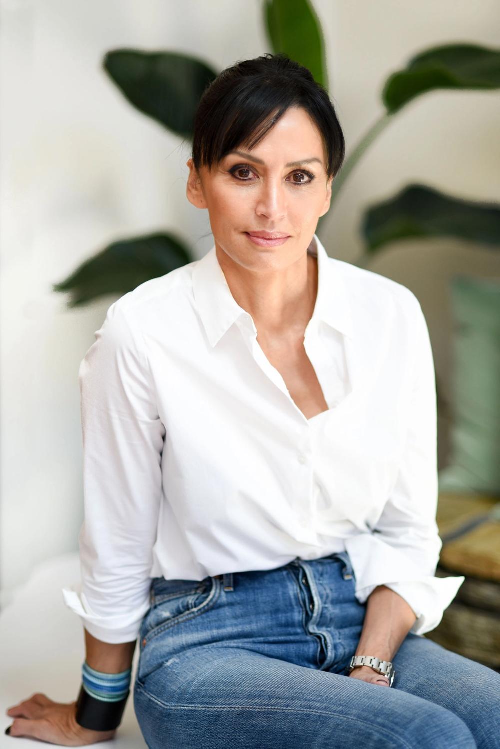 business woman, books in background