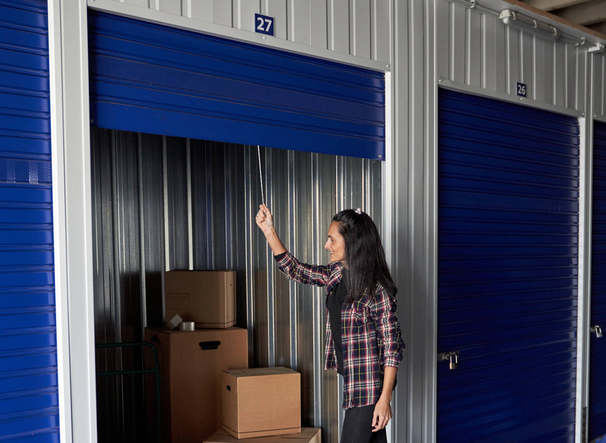 Women opening self storage unit