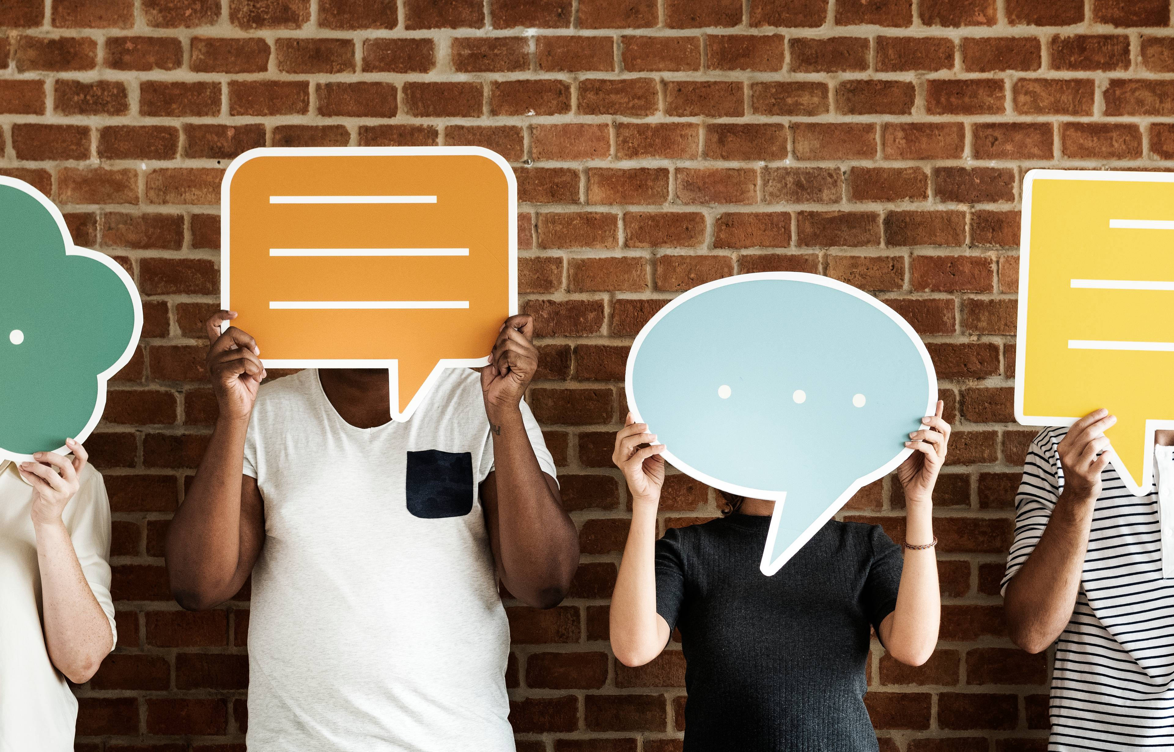 People holding speech bubble icons