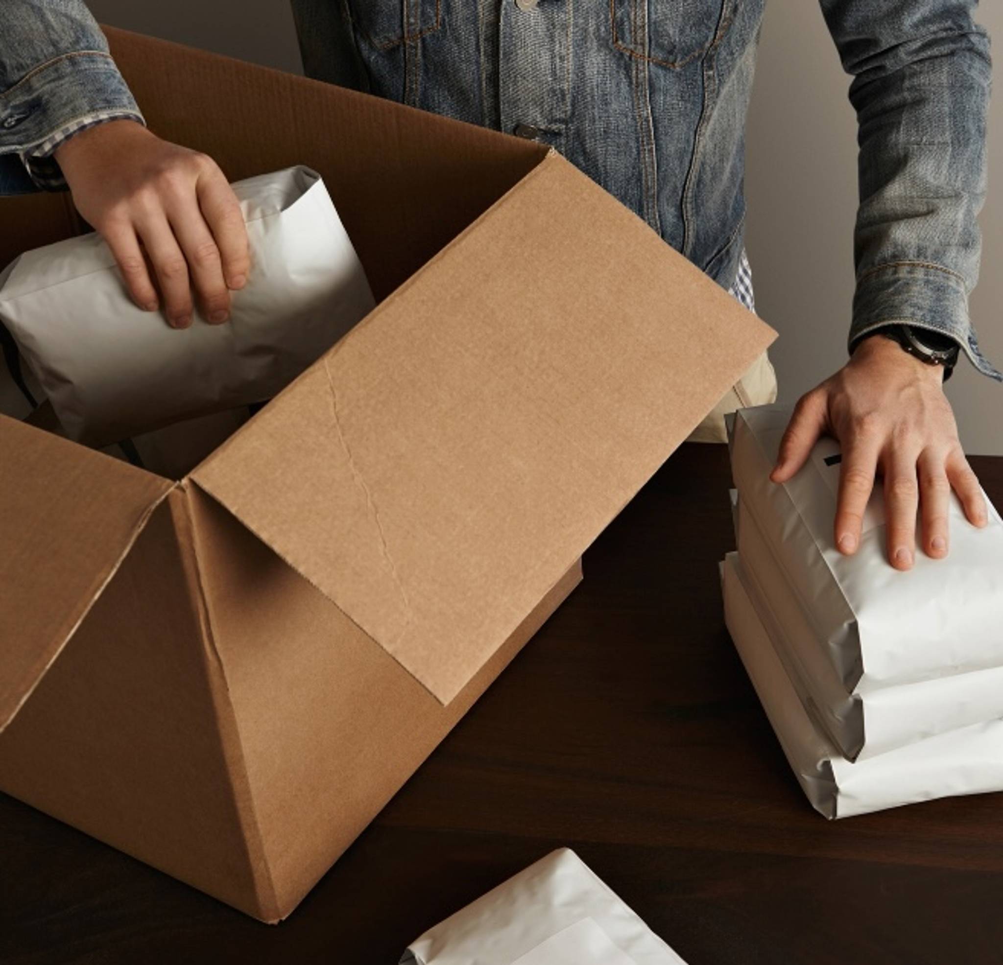 coffee shop box man putting coffee bags in