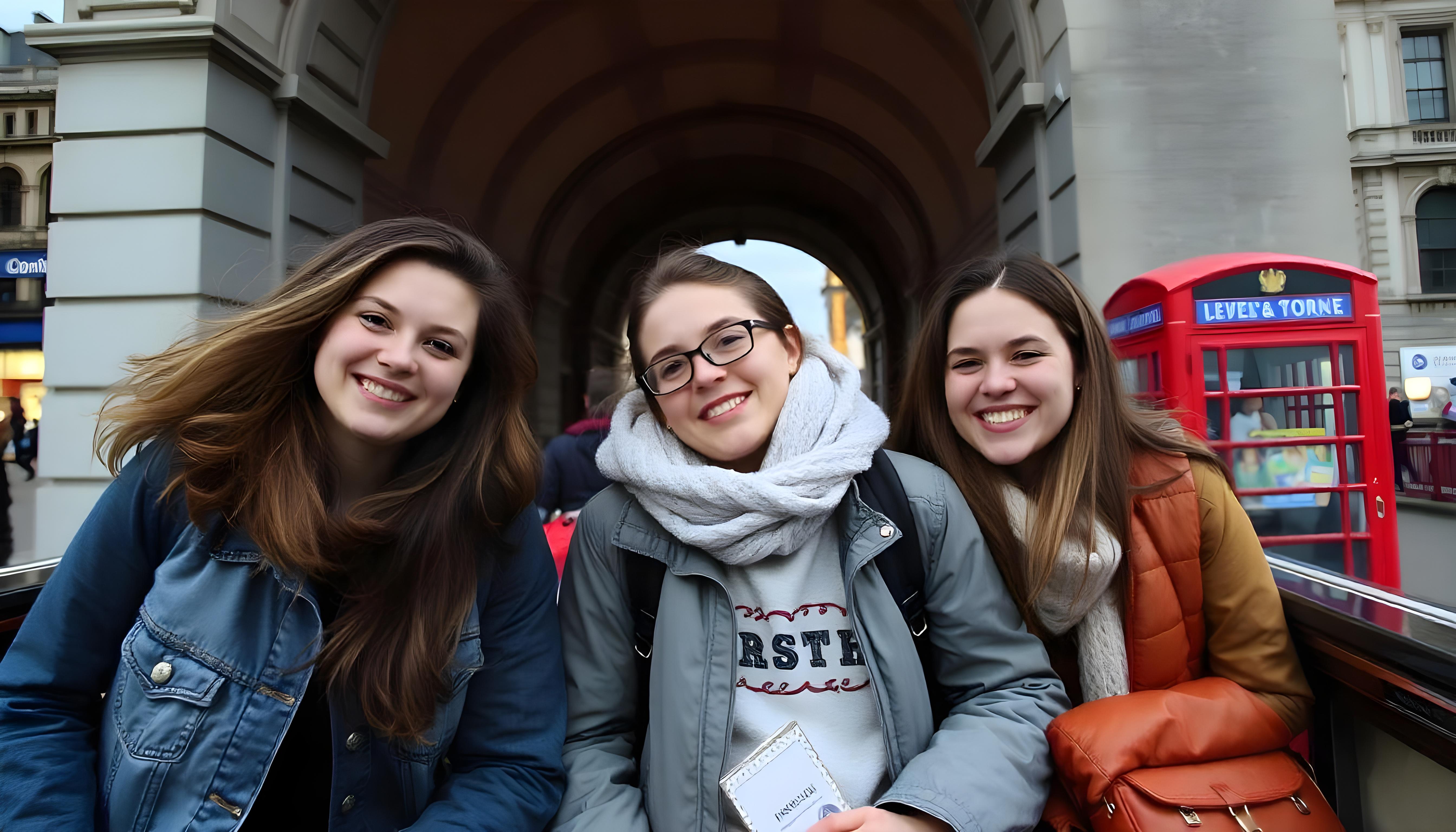 Three women are posing for a picture with one wearing a scarf