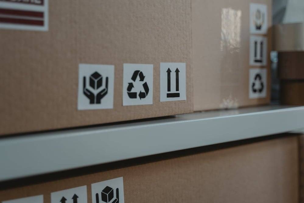 Boxes stored properly, with warning labels.