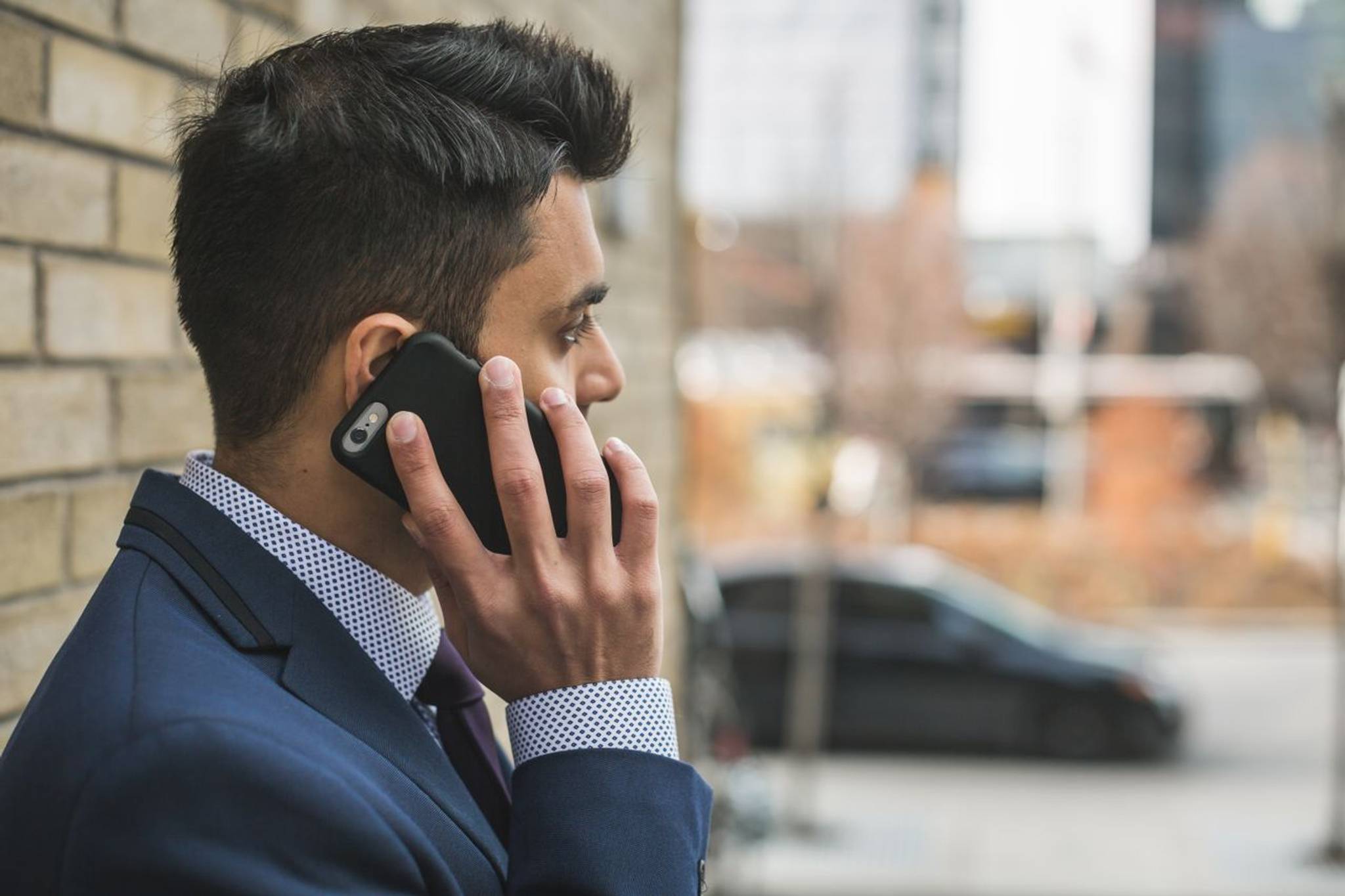 business man in suit on phone