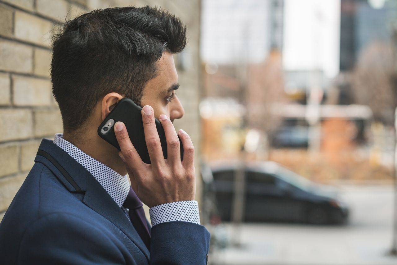 business man in suit on phone