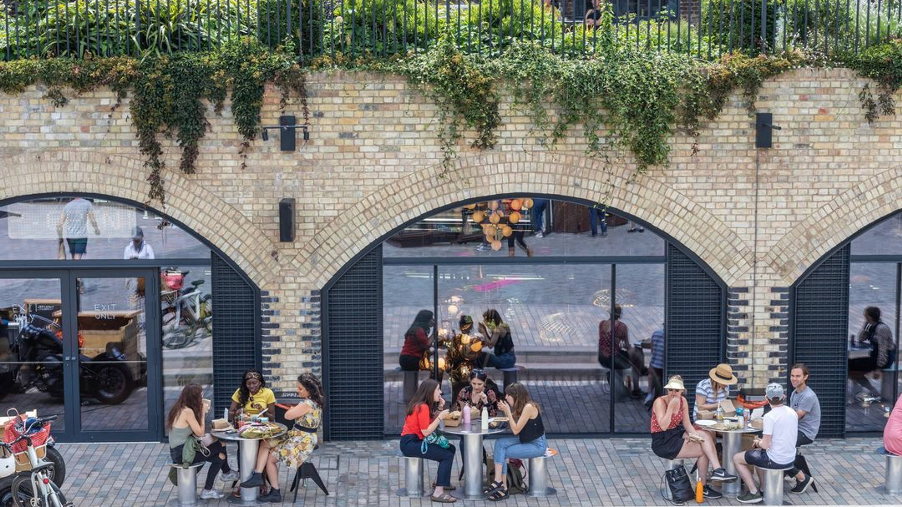 people sitting outside and eating