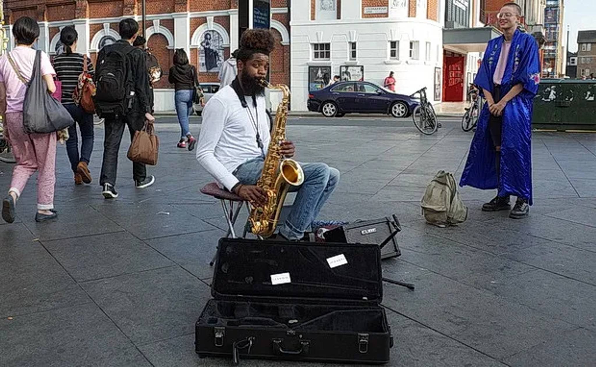 saxophonist busking in brixton