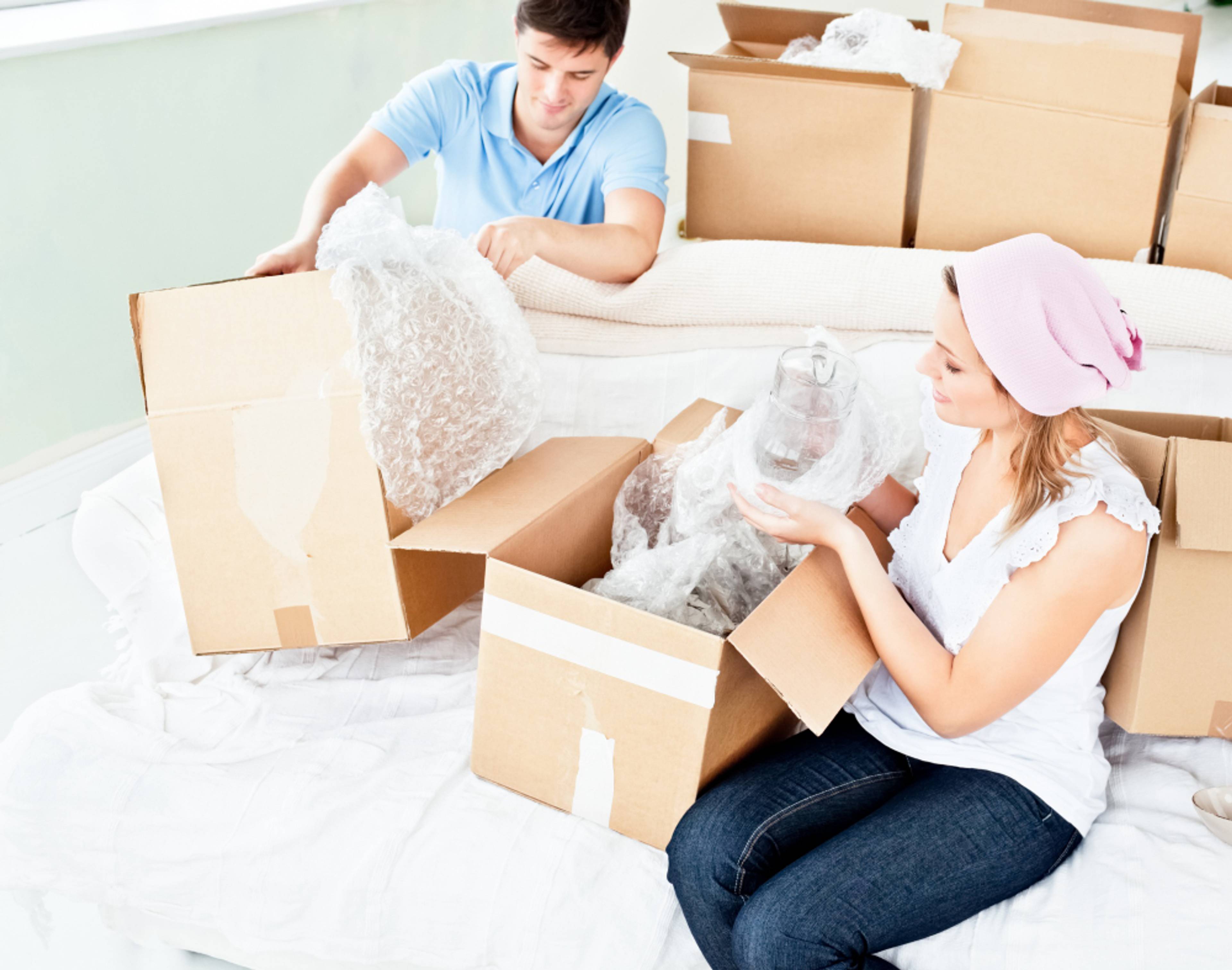 couple packing boxes for house move