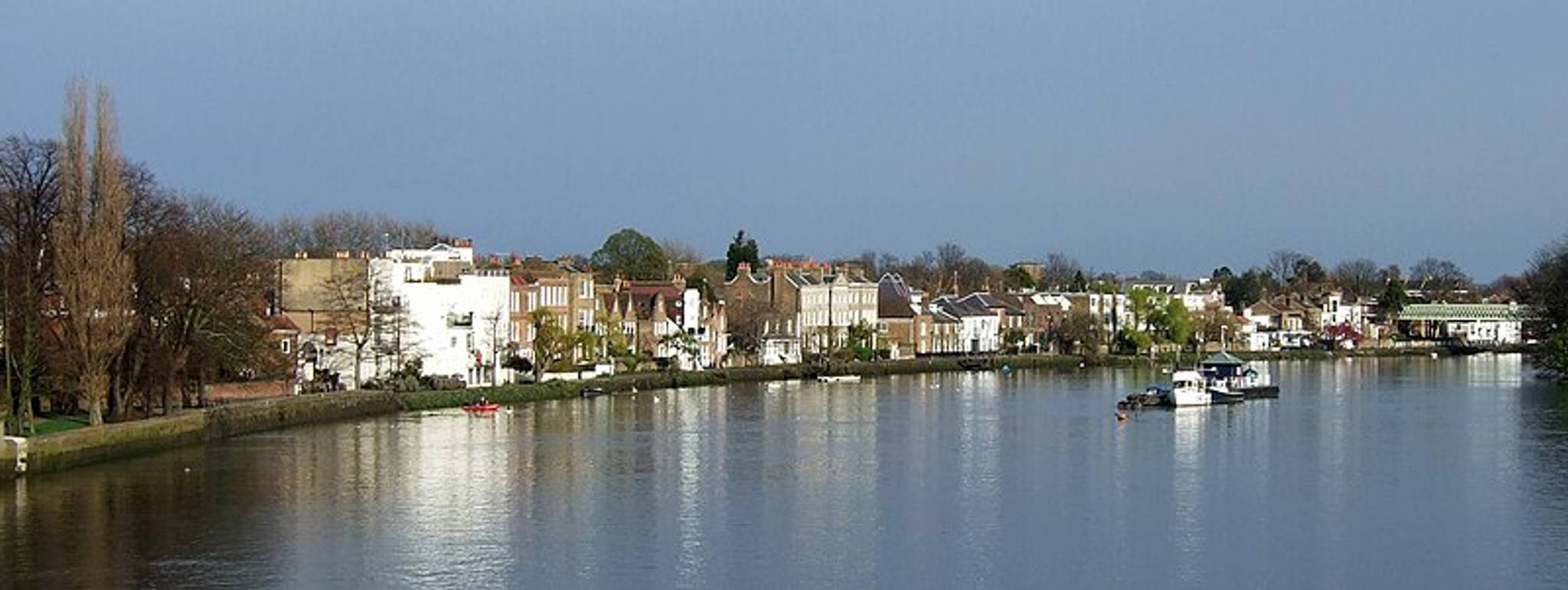 Strand-on-the-Green, Chiswick, Middlesex, looking downstream (East) from Kew Bridge. Oliver's Island is on the right in front of the railway bridge
