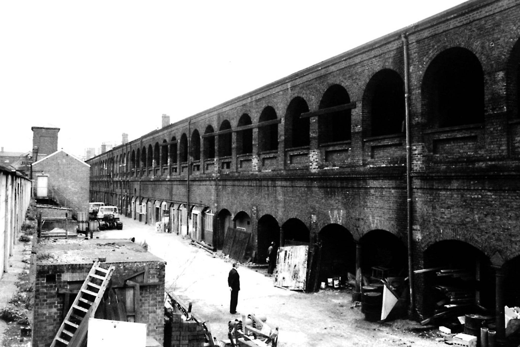 An image of the historic Coal Drops Yard during the Victorian Era, showcasing the bustling industrial landscape of the time.