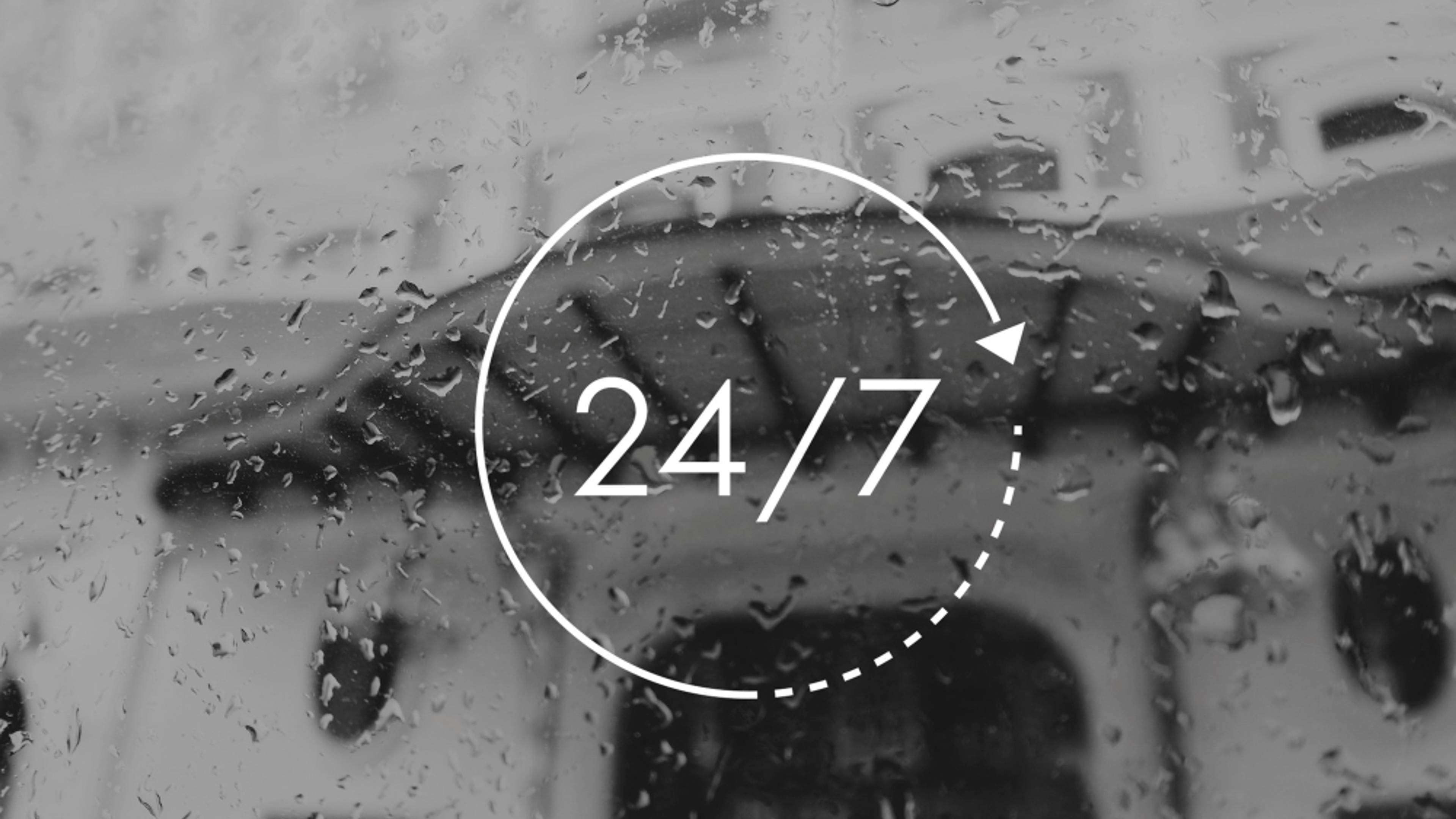 24/7 sign with a rainy background
