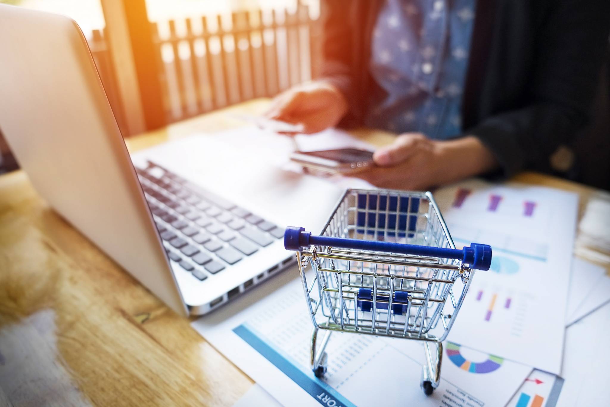 Woman inputting card details to do online shopping