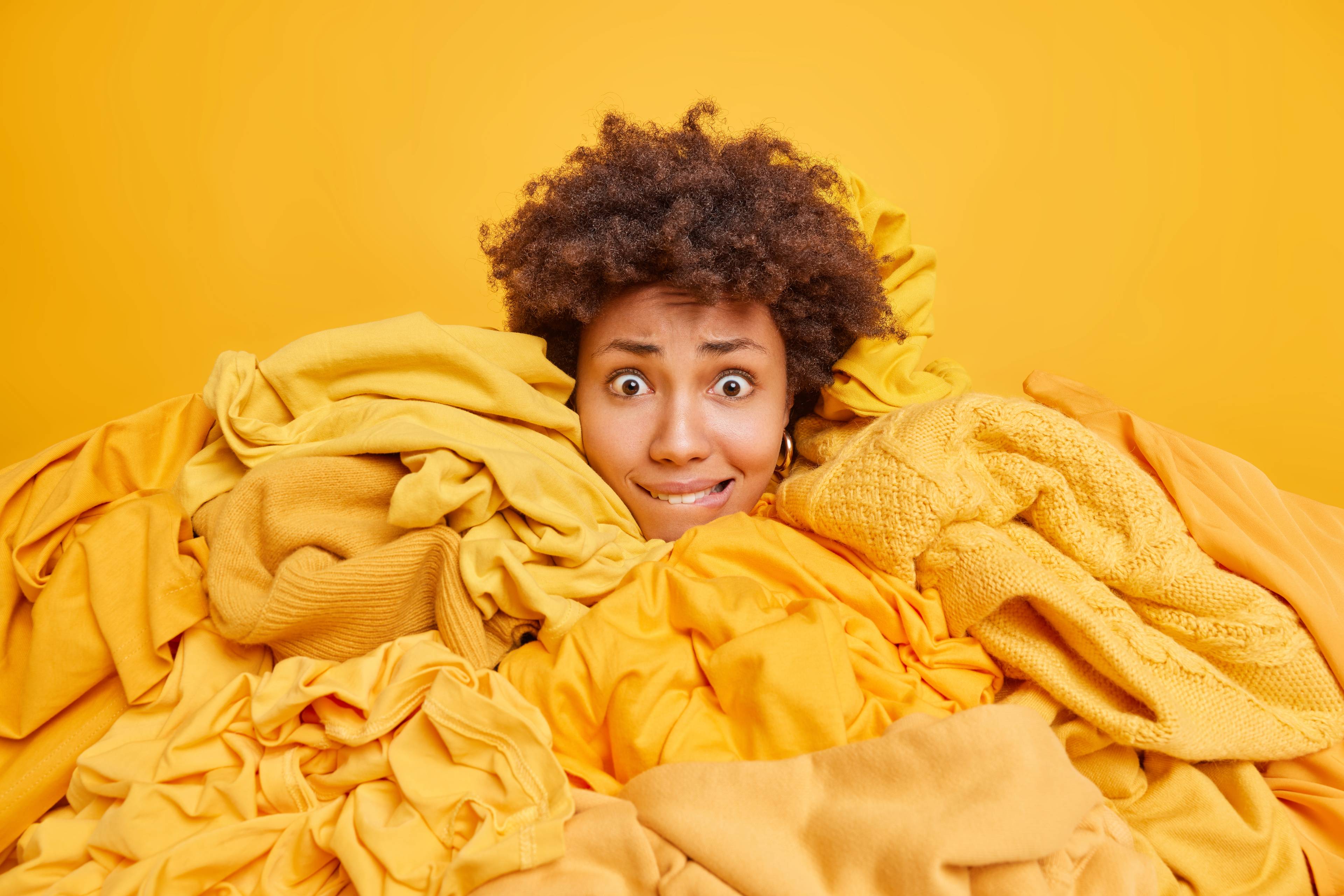 Worried woman covered in orange clothes