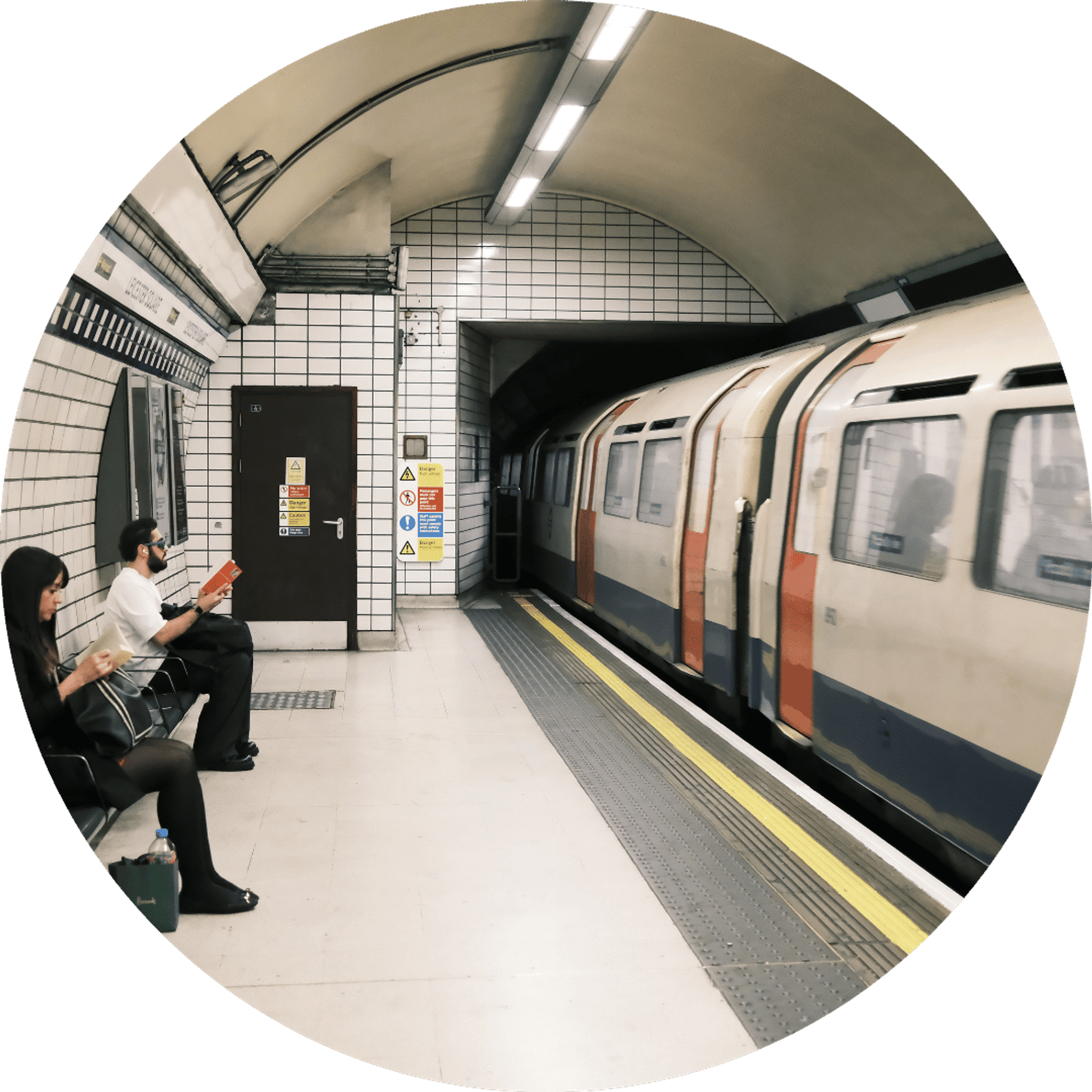 people waiting at london underground train going by