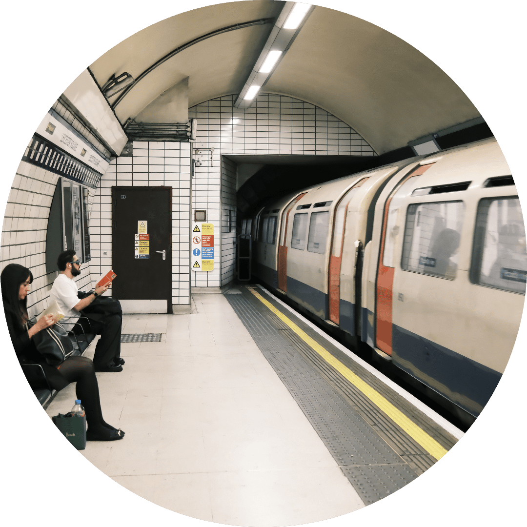 people waiting at london underground train going by