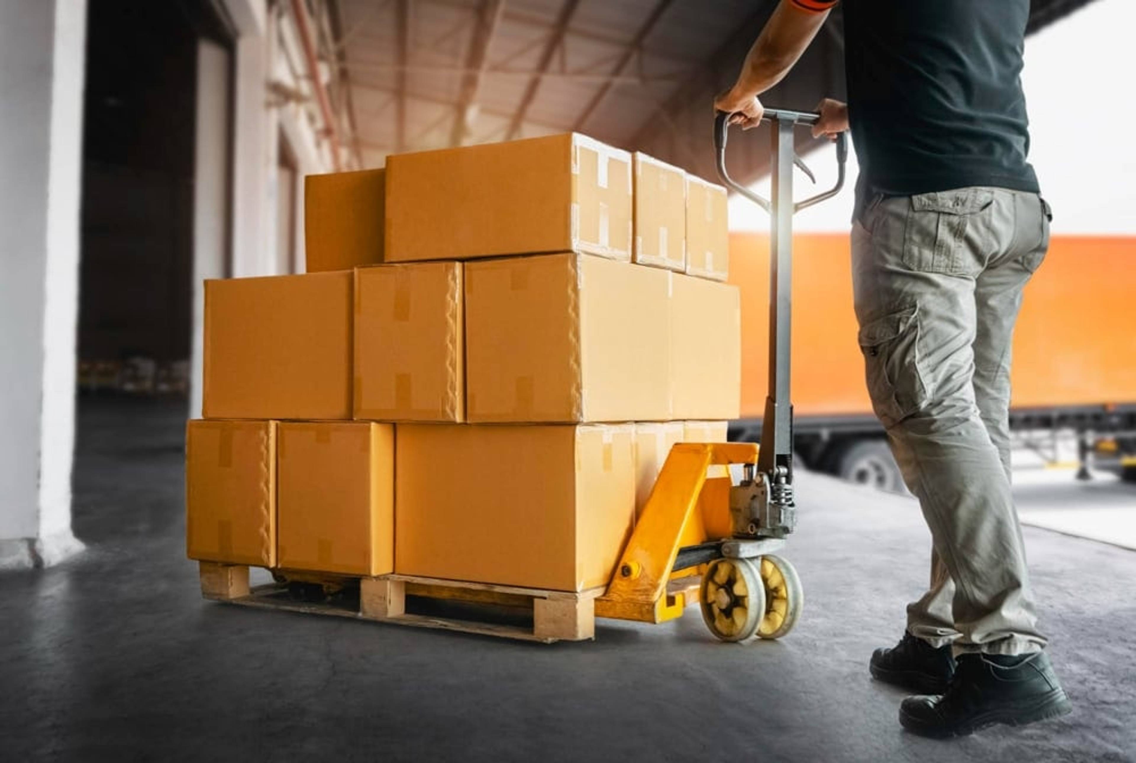 Storage boxes on a pallet, being moved into storage