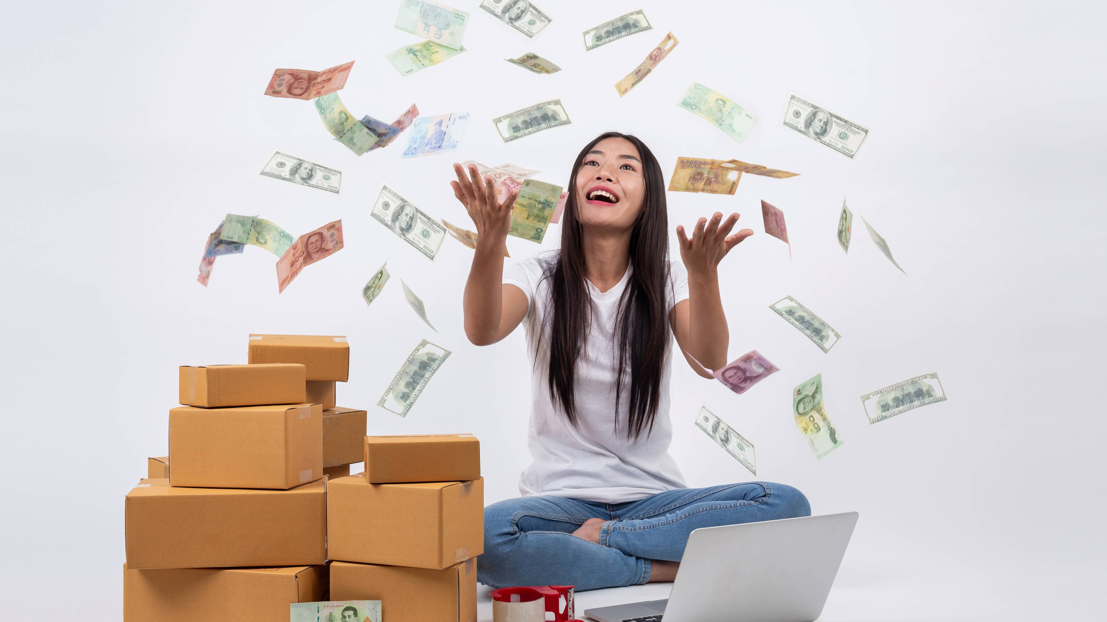 Woman happily throwing money into the air as if to celebrate