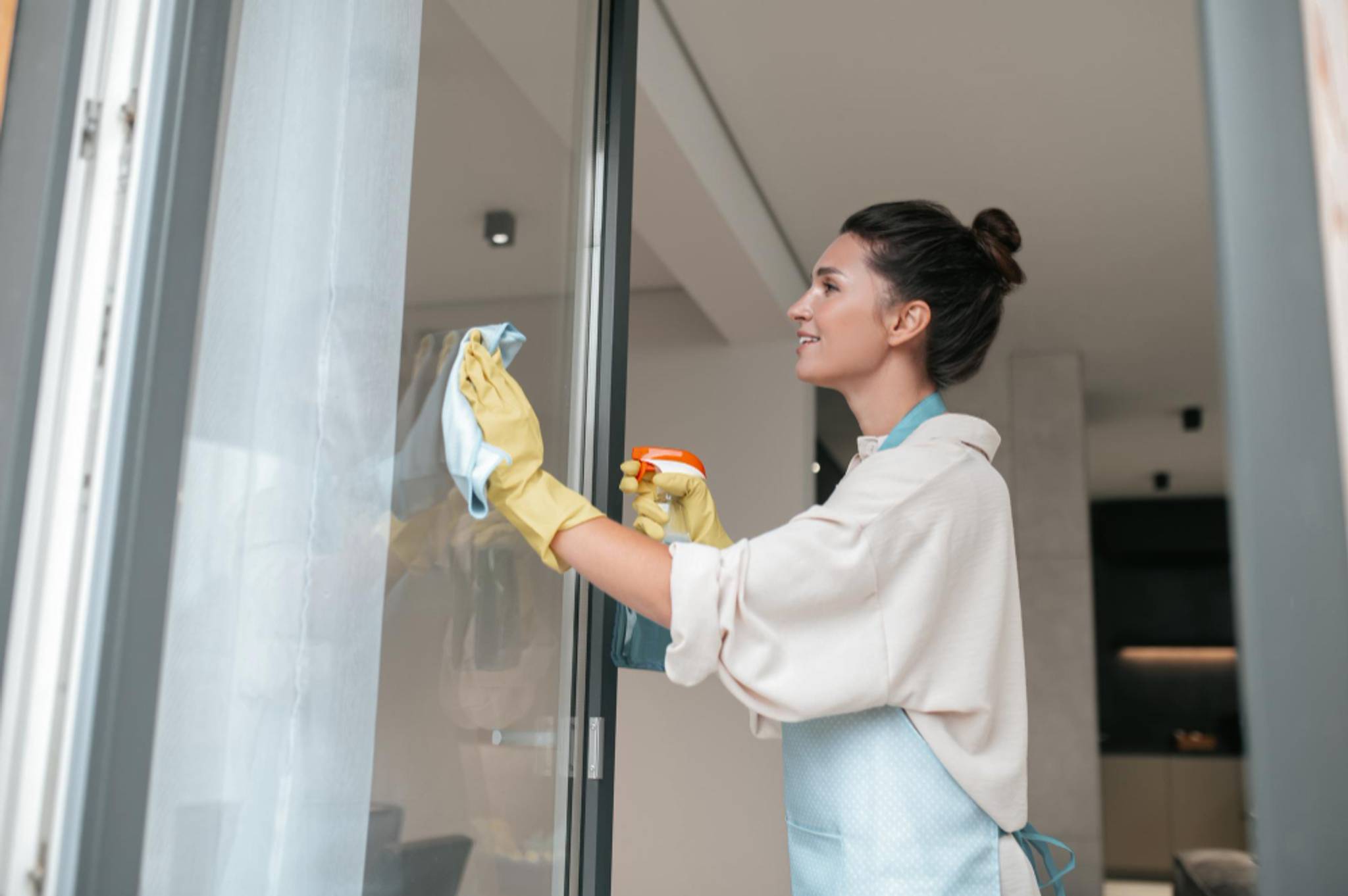 woman cleaning windows