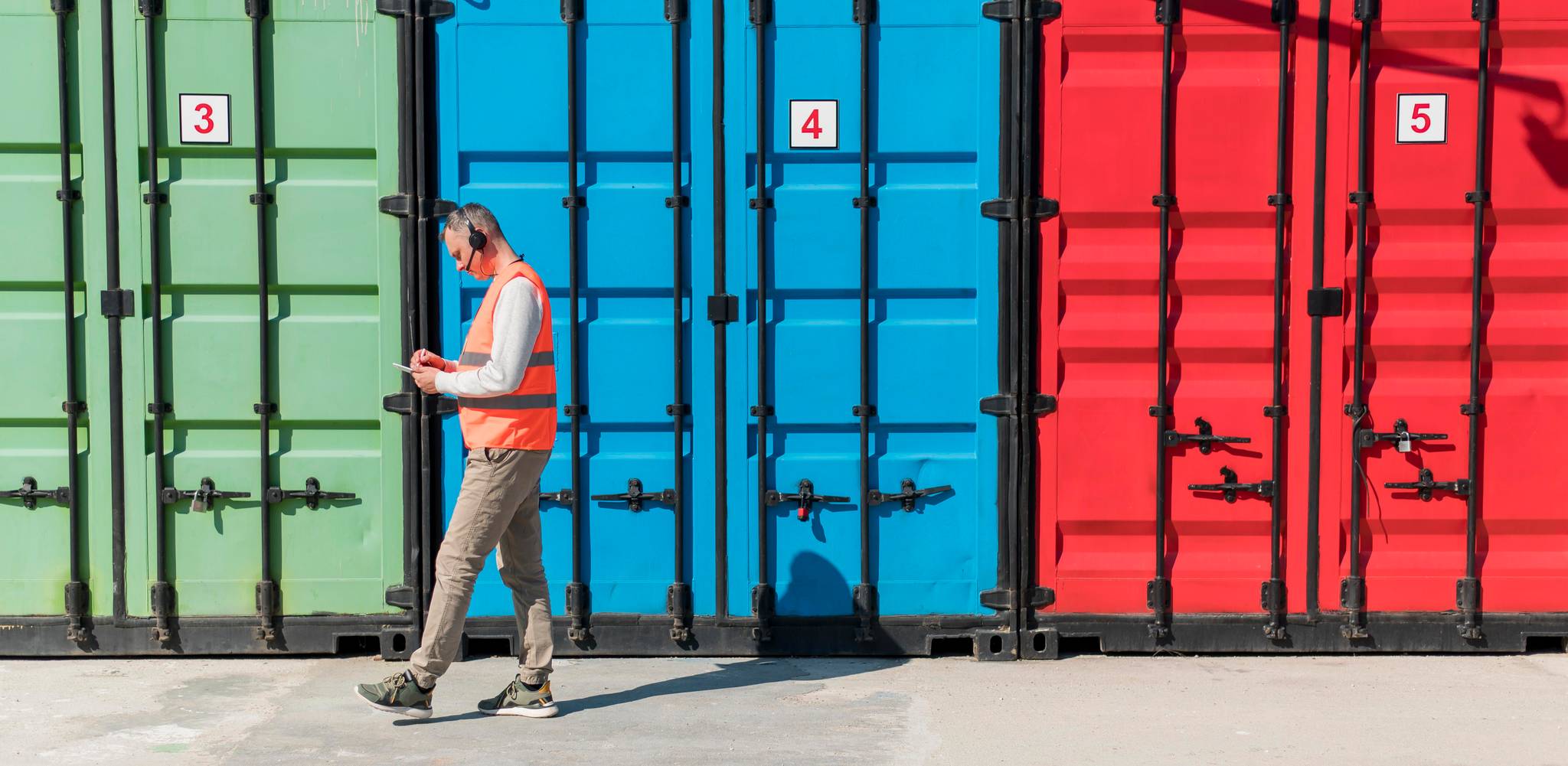 Man in front of container storage
