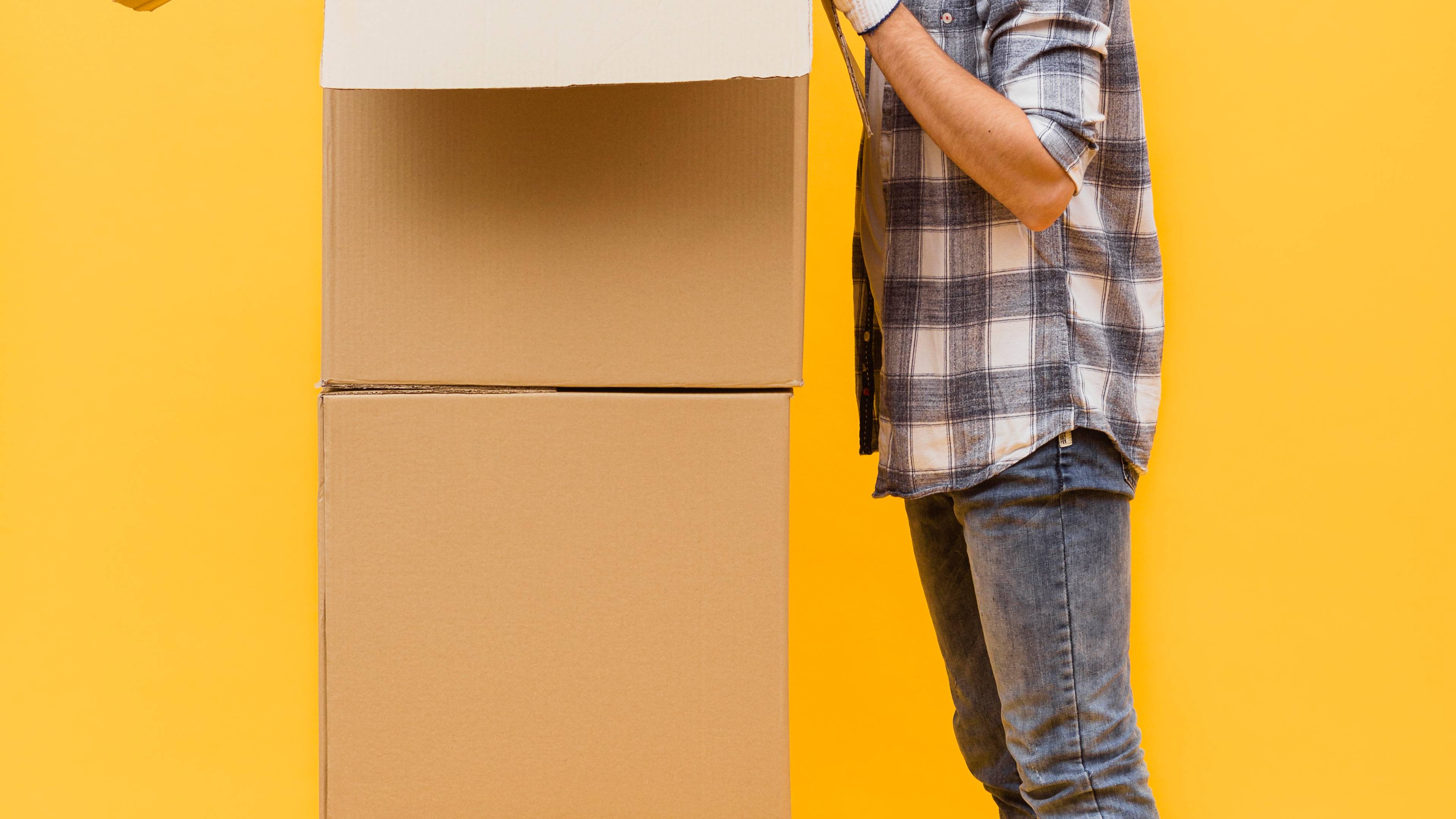 Side view of man looking at packages.