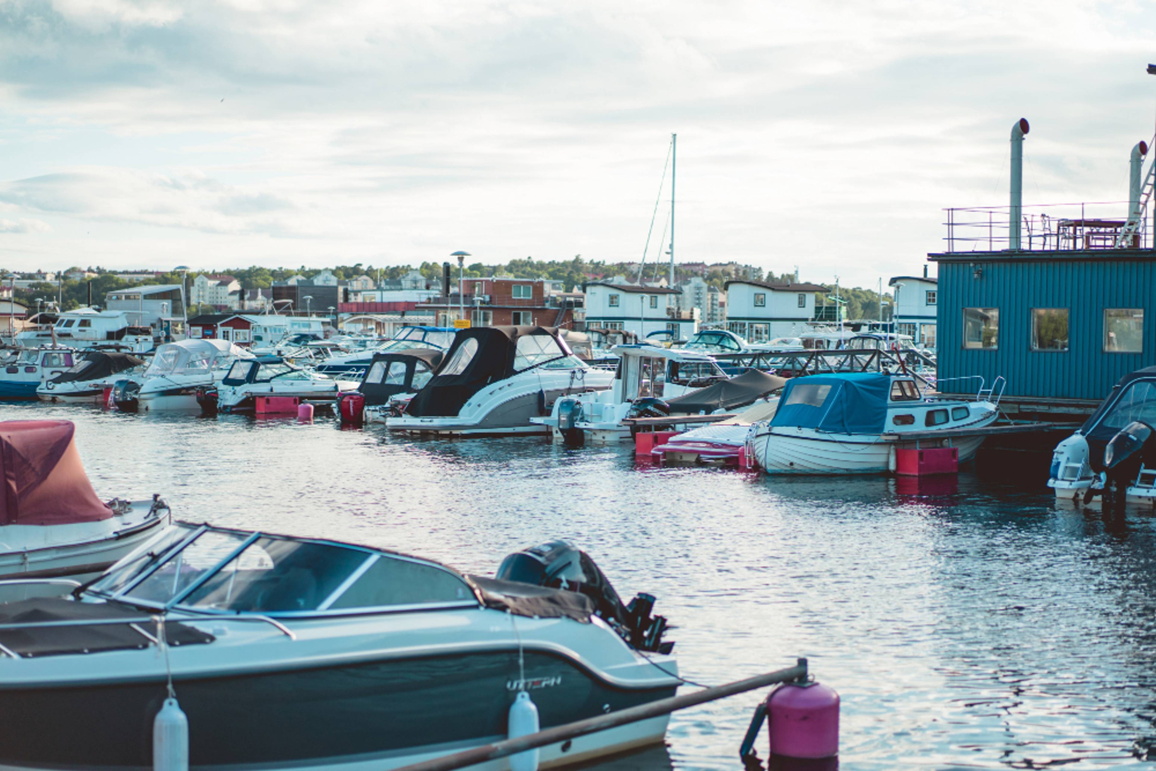Boats stored in a marina on a cloudy day