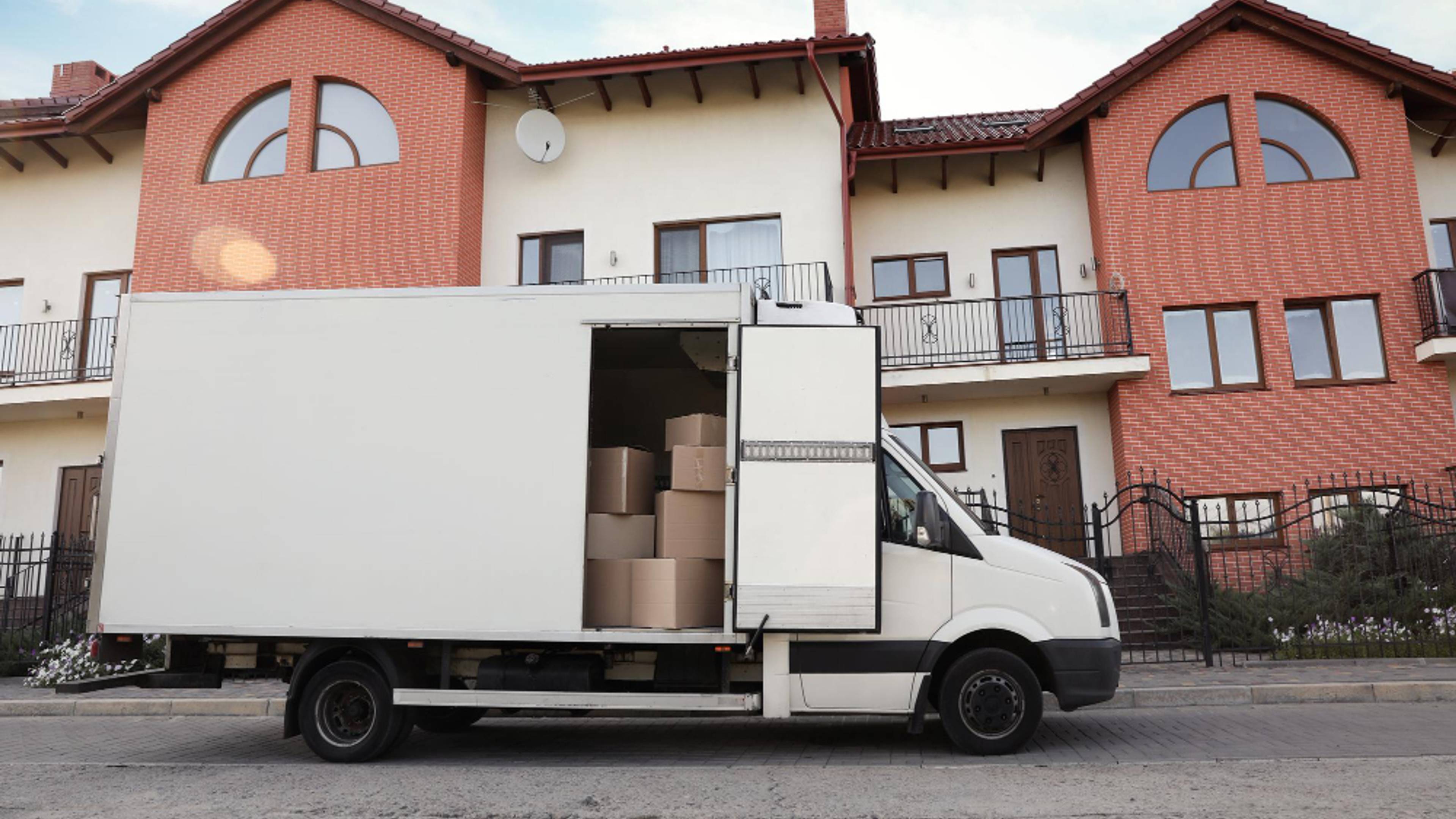 removal van with side door open outside house