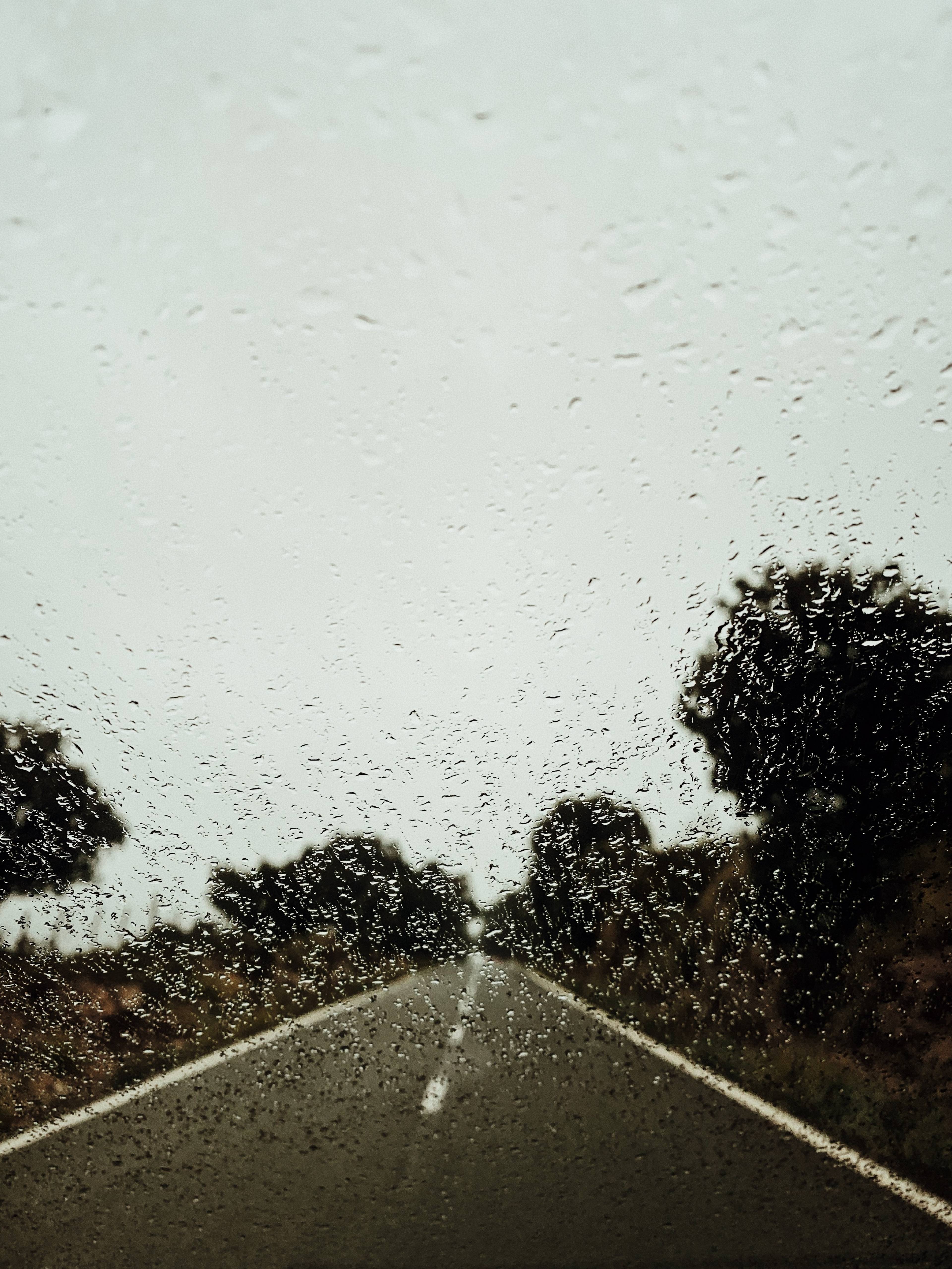 Vertical shot of rain against car