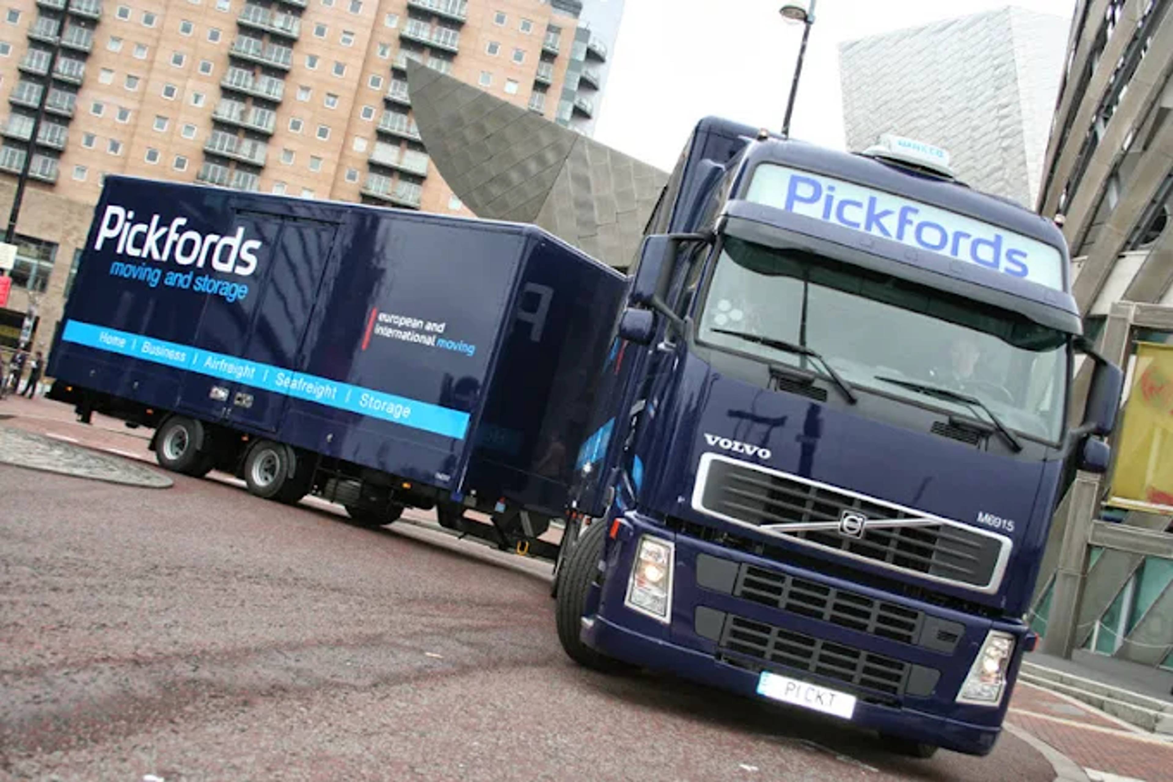branded blue lorry turning corner