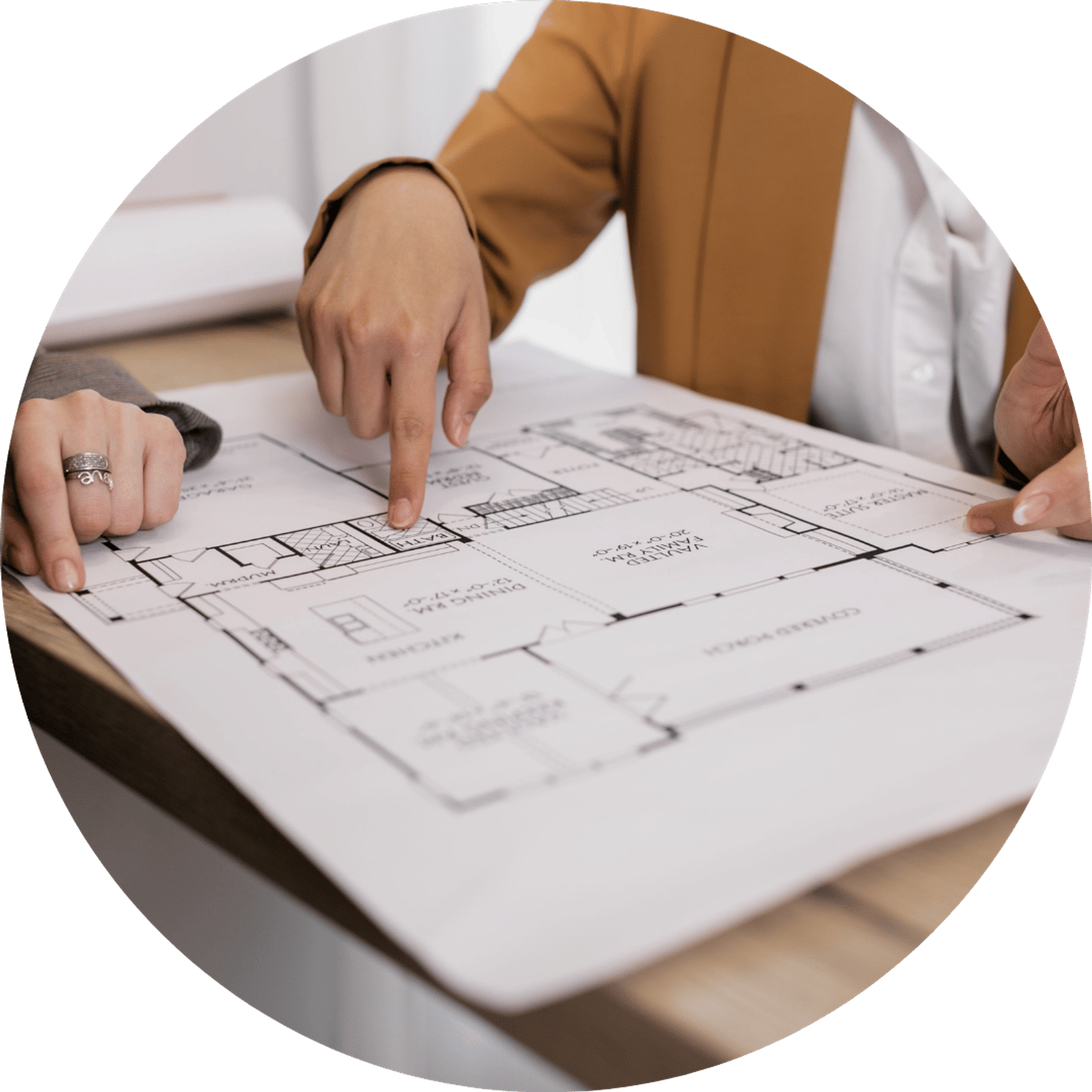 office managers looking at office blueprint for downaizing