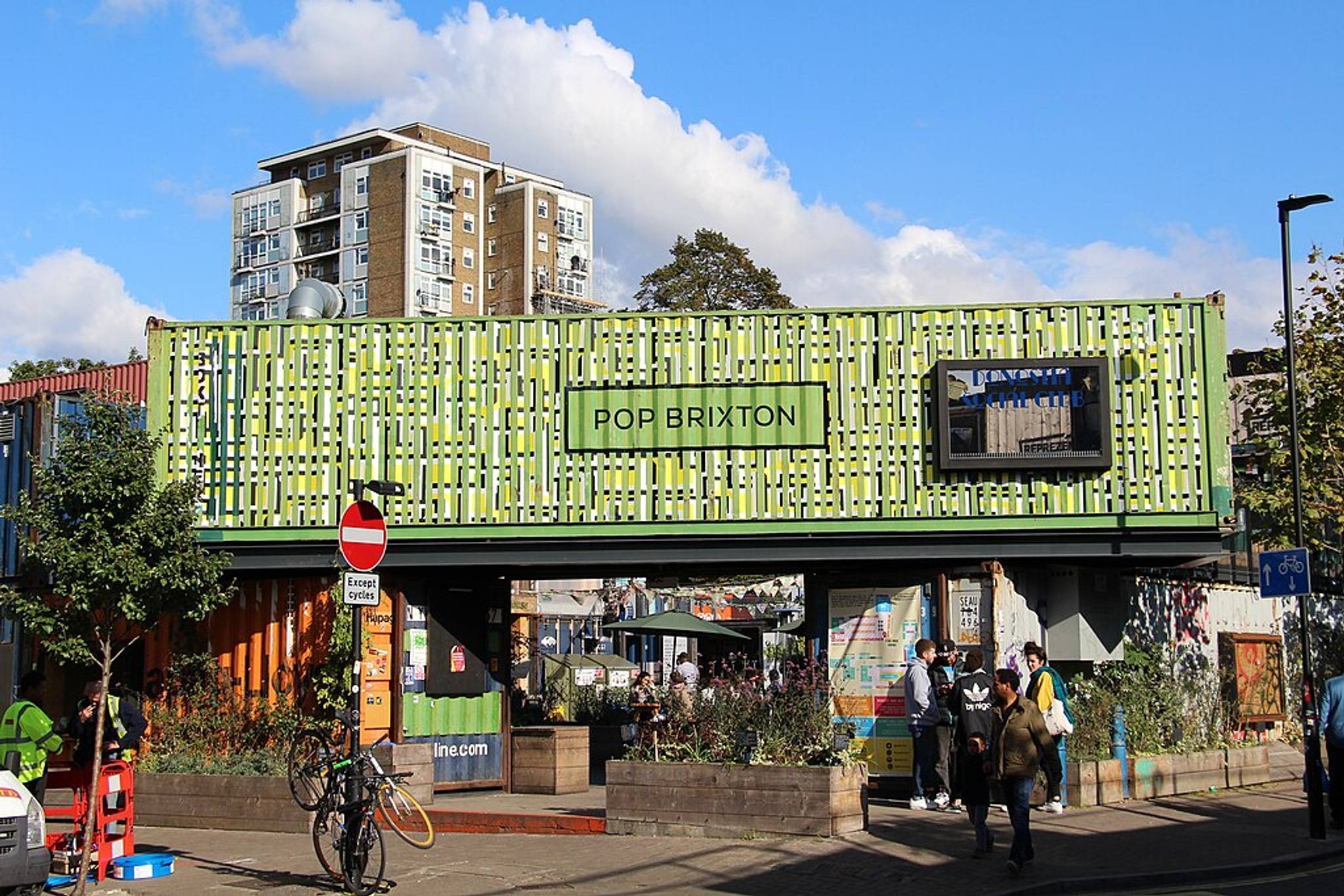 pop brixton sign on bridge sunny day