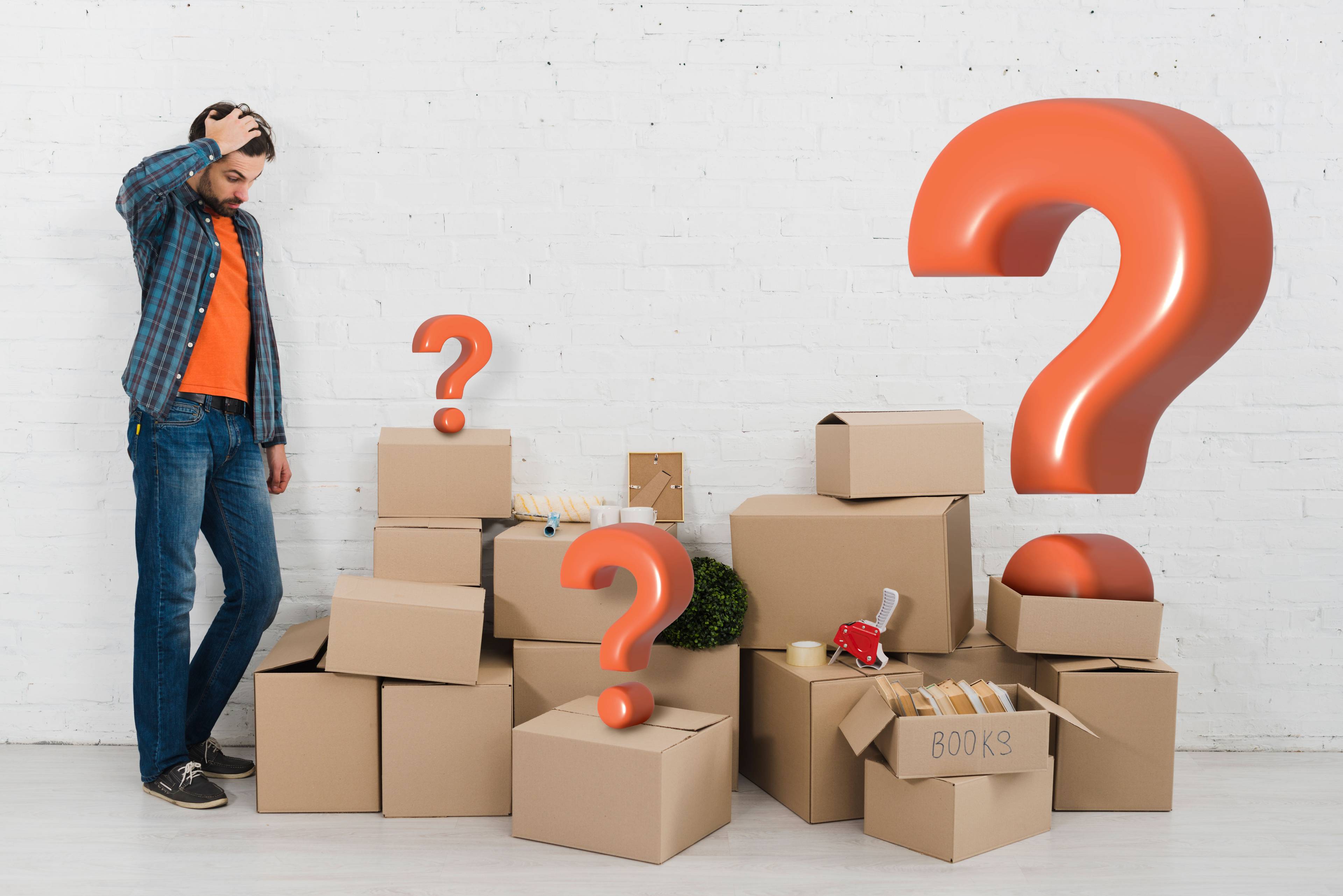 Man next to cardboard boxes with question marks