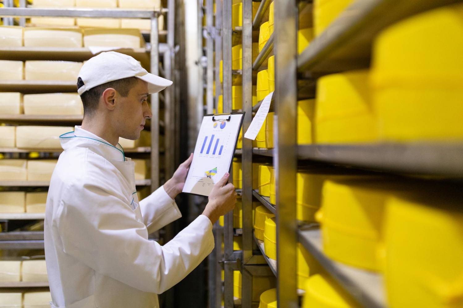 Worker with clipboard checking stock
