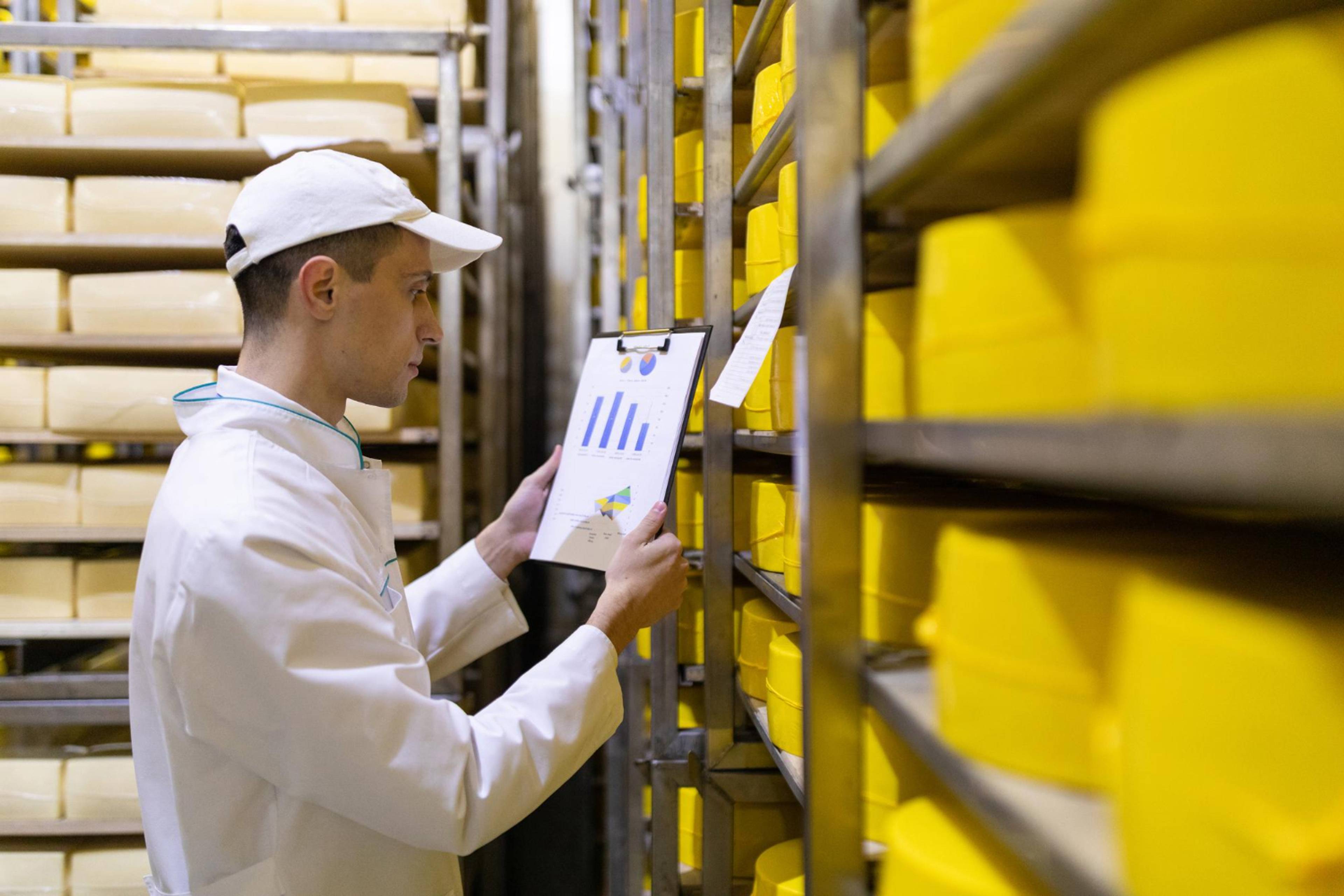 Worker with clipboard checking stock