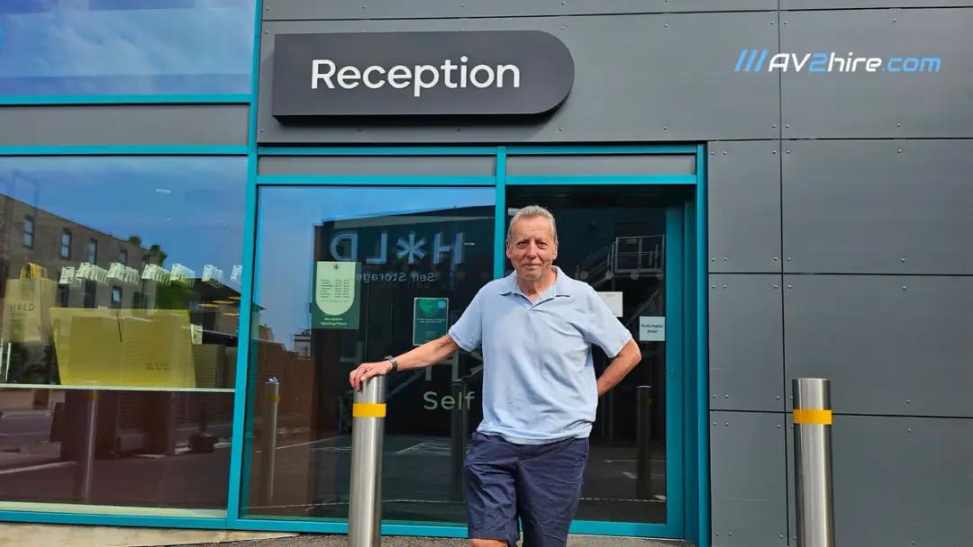 business owner standing outisde reception